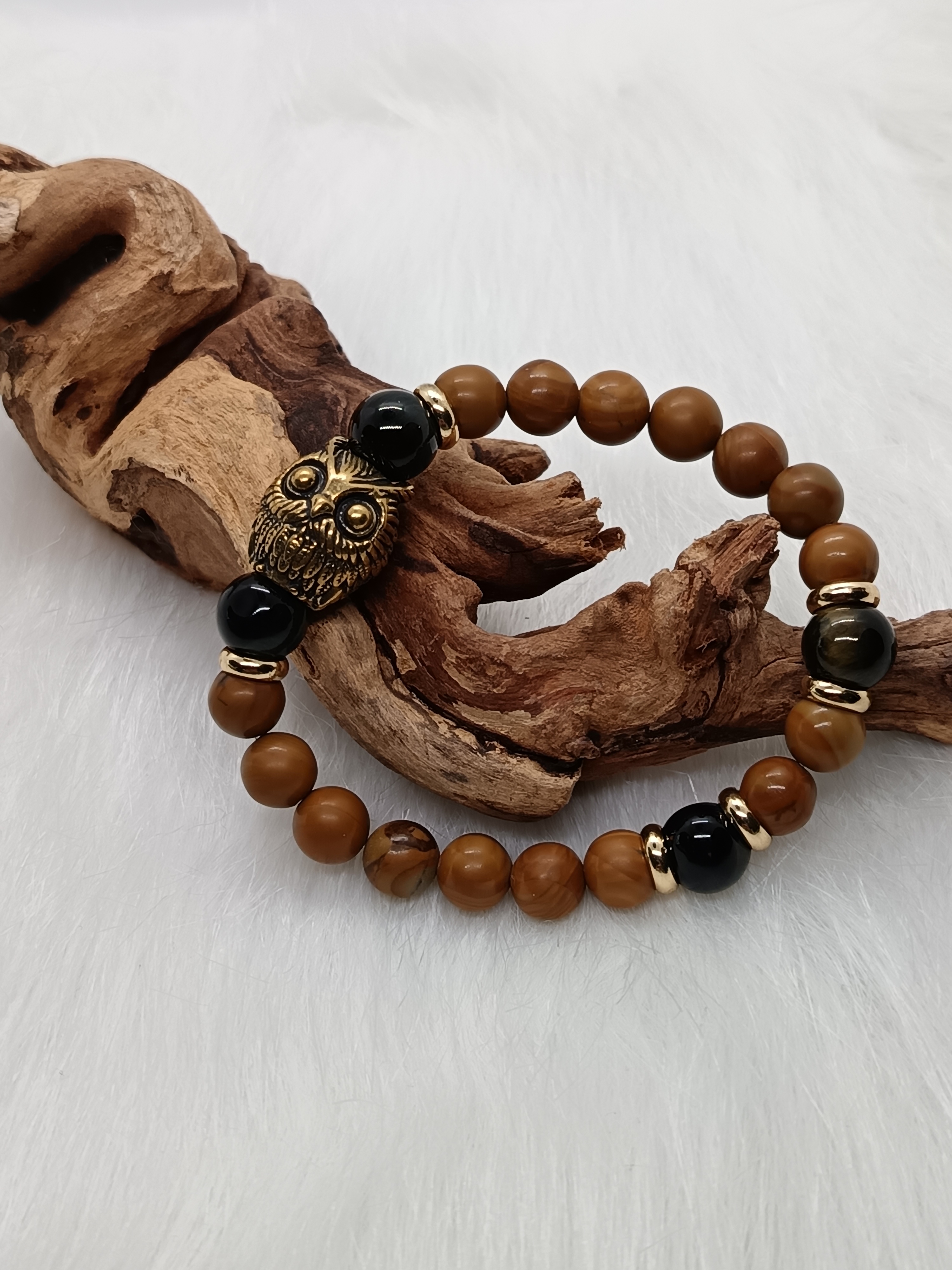 Bracelet "hibou" en bois fossilisé et œil de faucon 