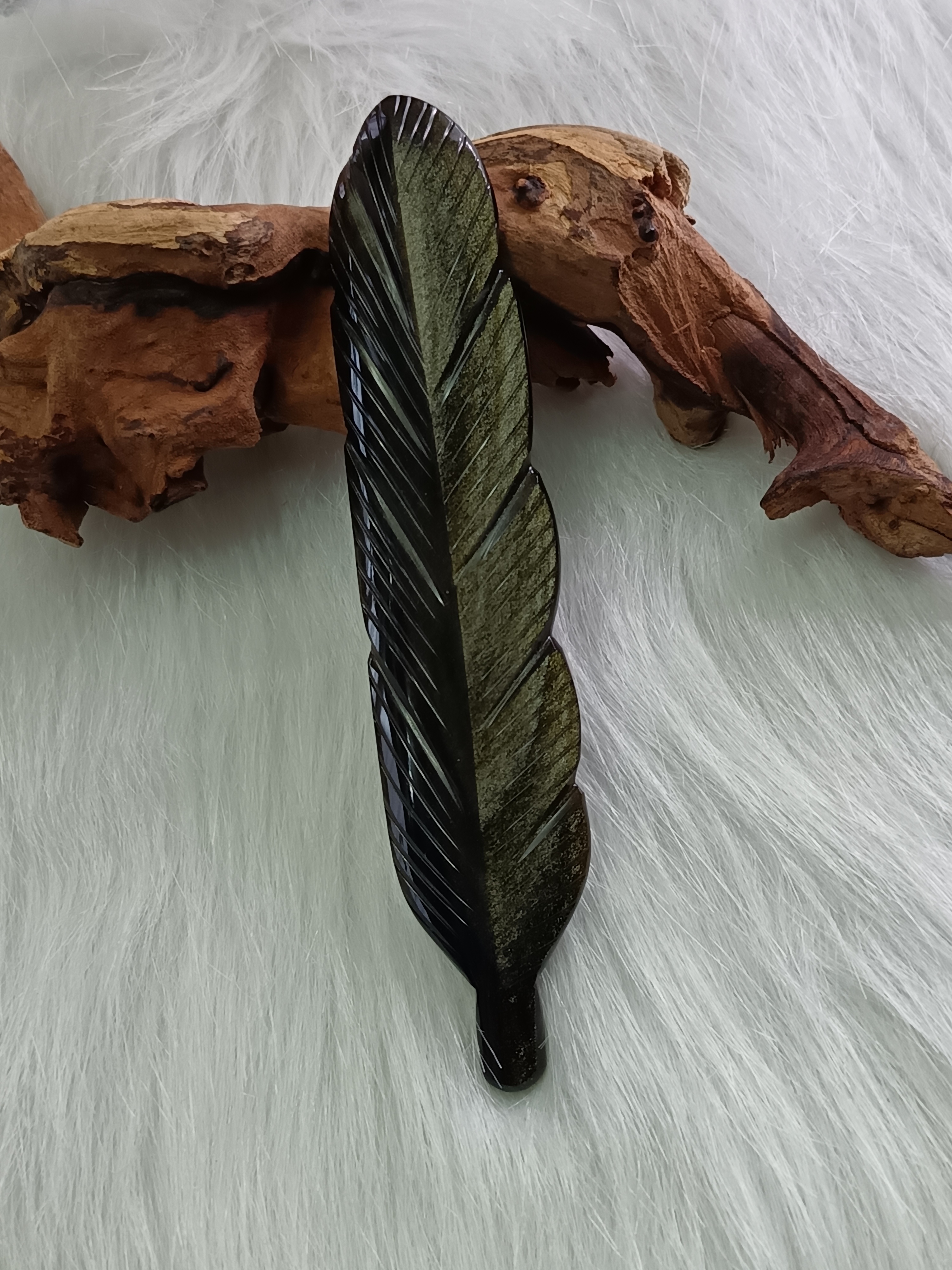 Plume en obsidienne dorée