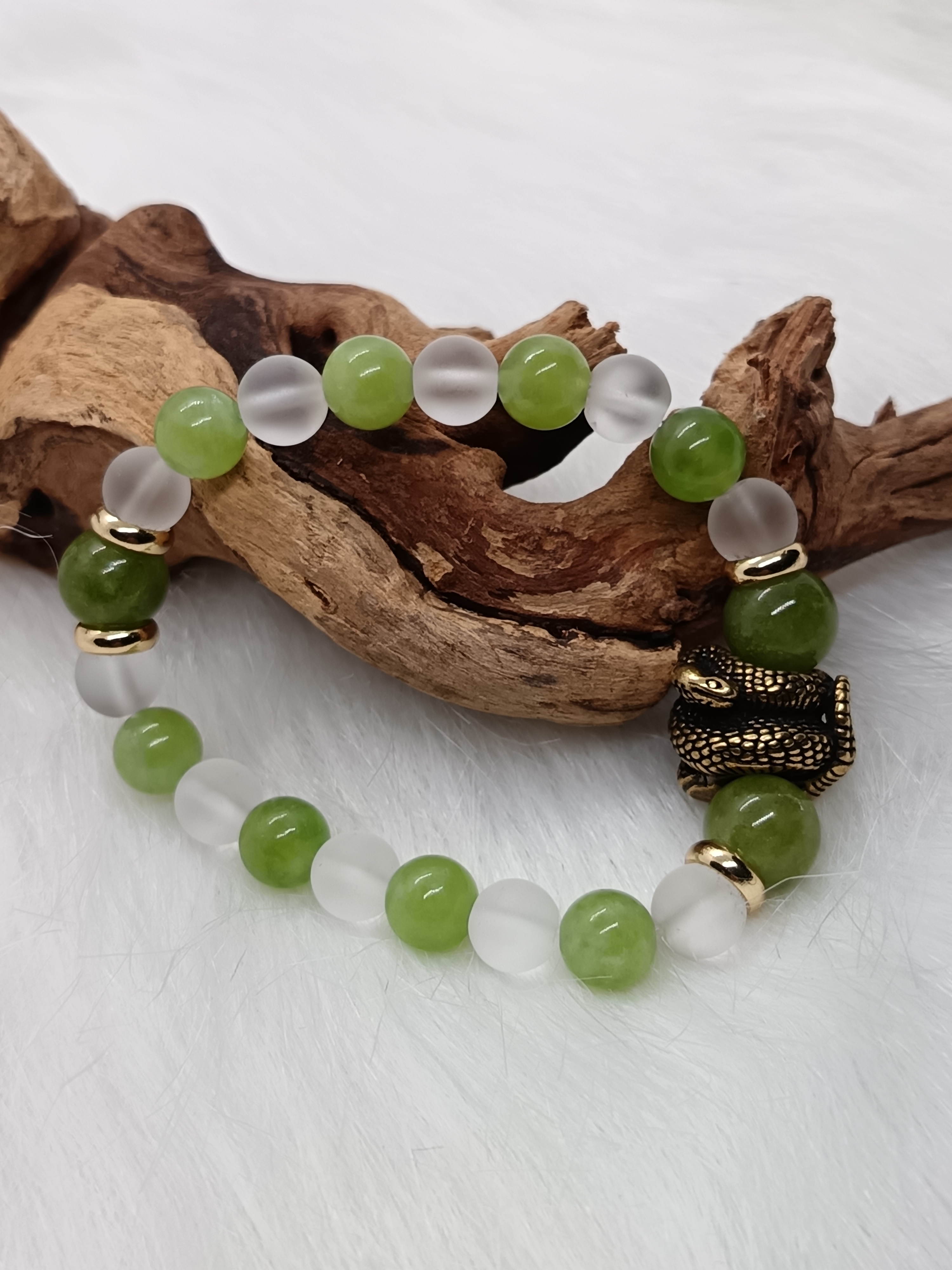 Bracelet "serpent" en péridot et cristal de roche mat