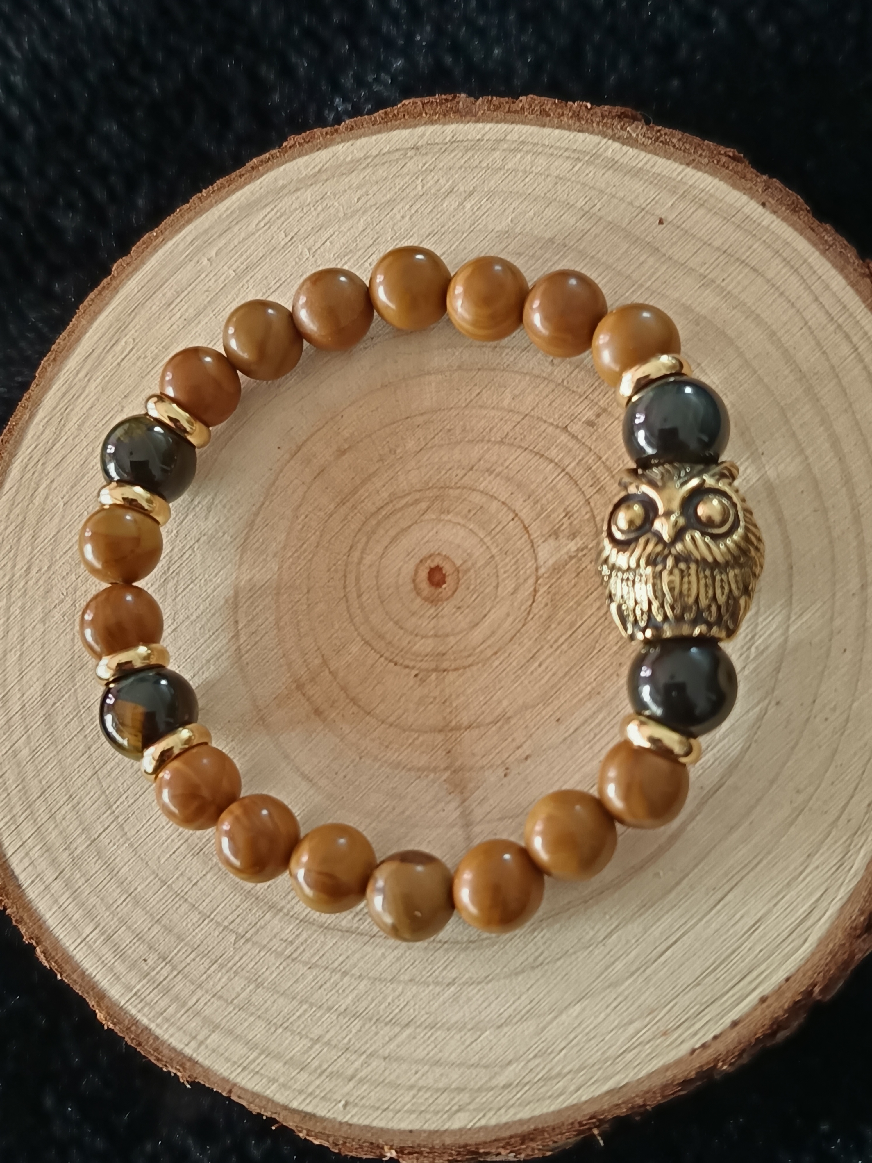 Bracelet "hibou" en bois fossilisé et œil de faucon 
