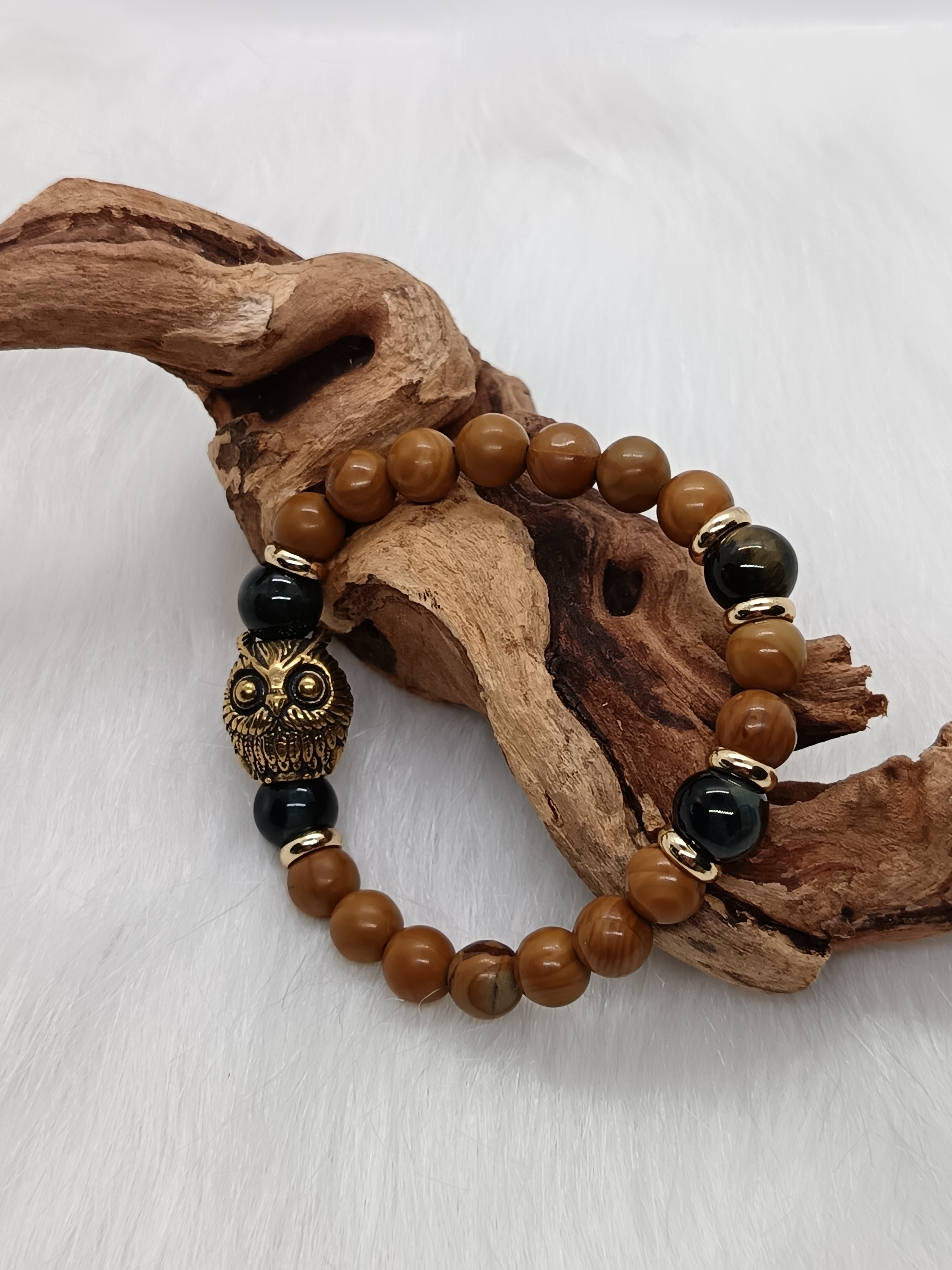 Bracelet "hibou" en bois fossilisé et œil de faucon