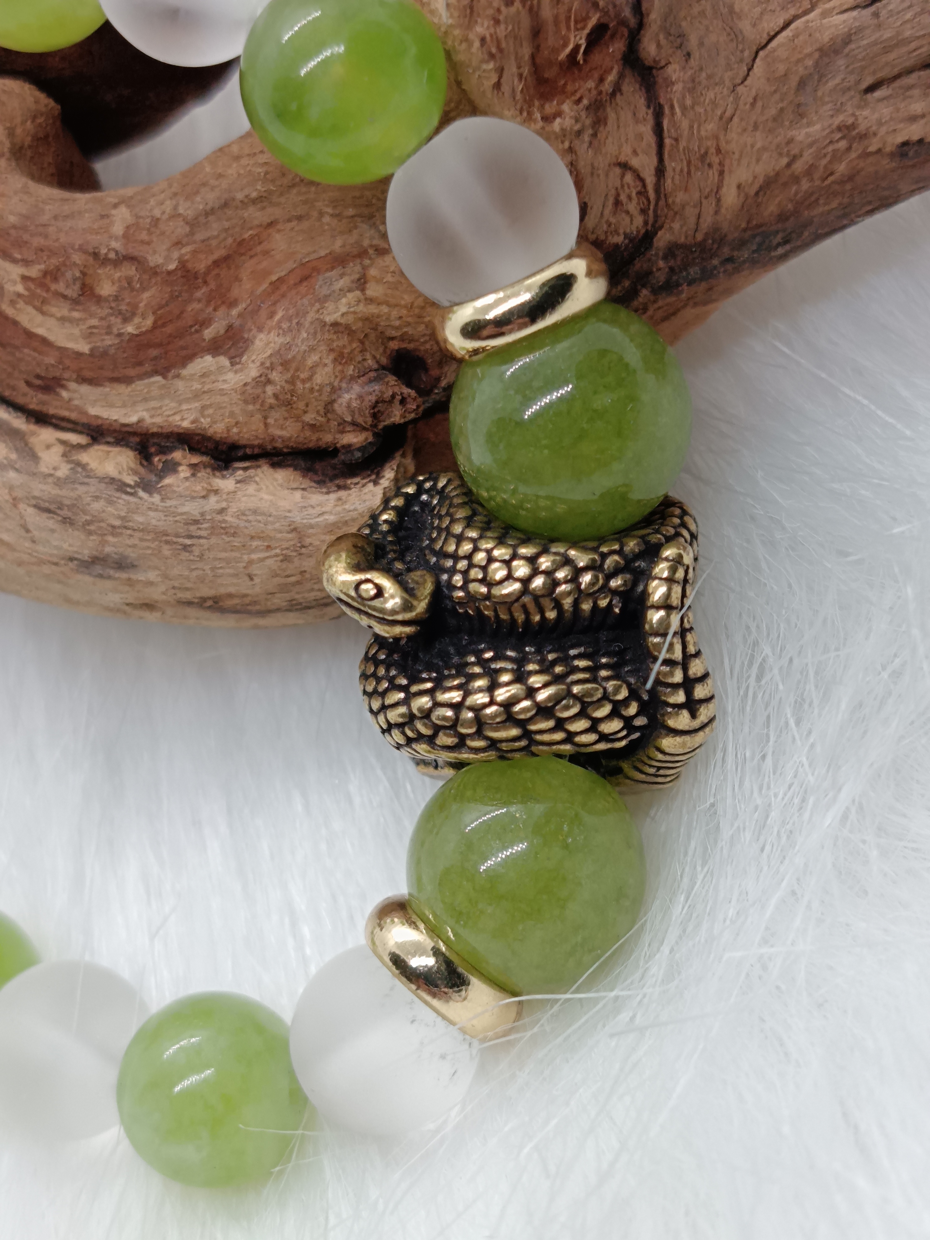 Bracelet "serpent" en péridot et cristal de roche mat