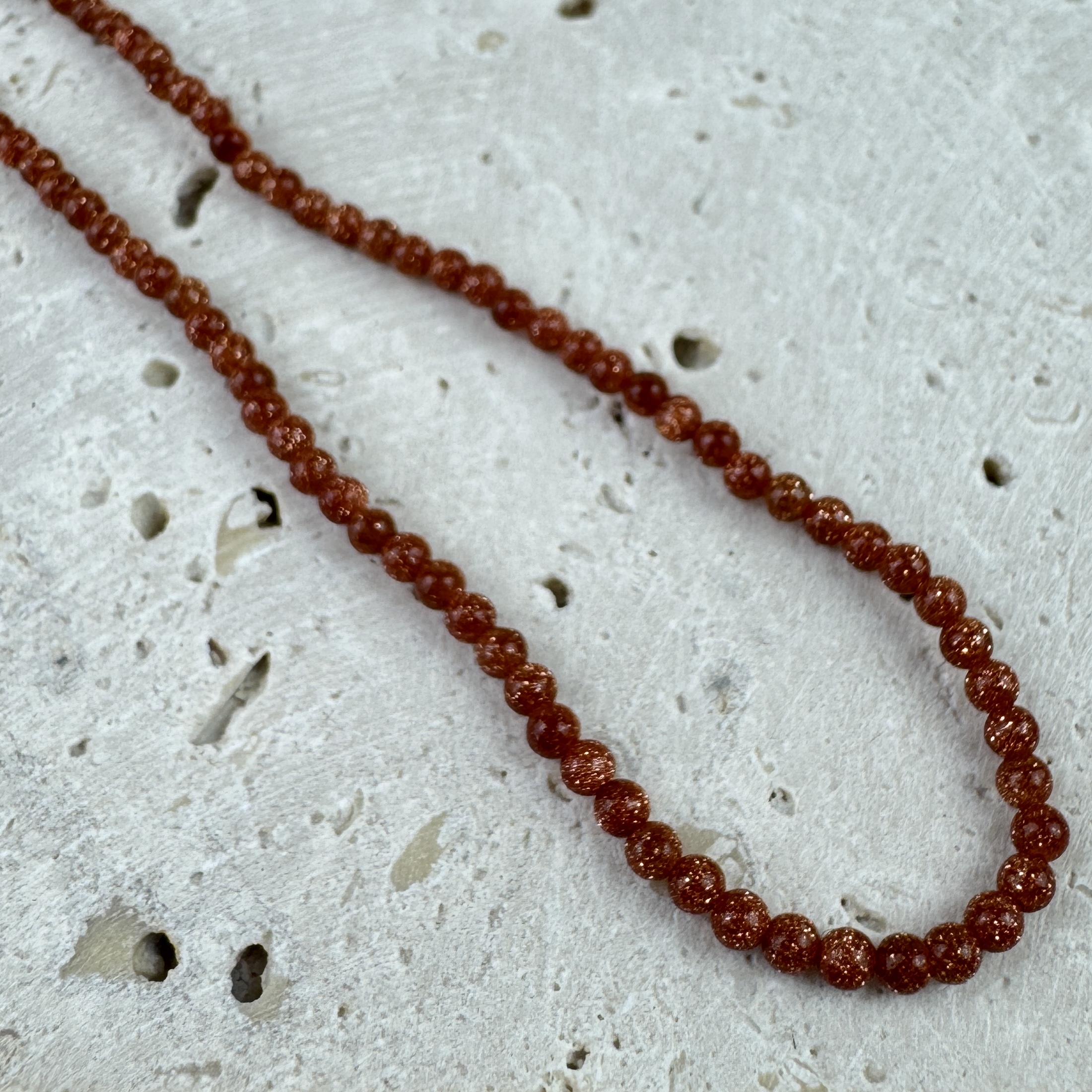 Saulės akmens vėrinys - Saulėlydžio švytėjimas