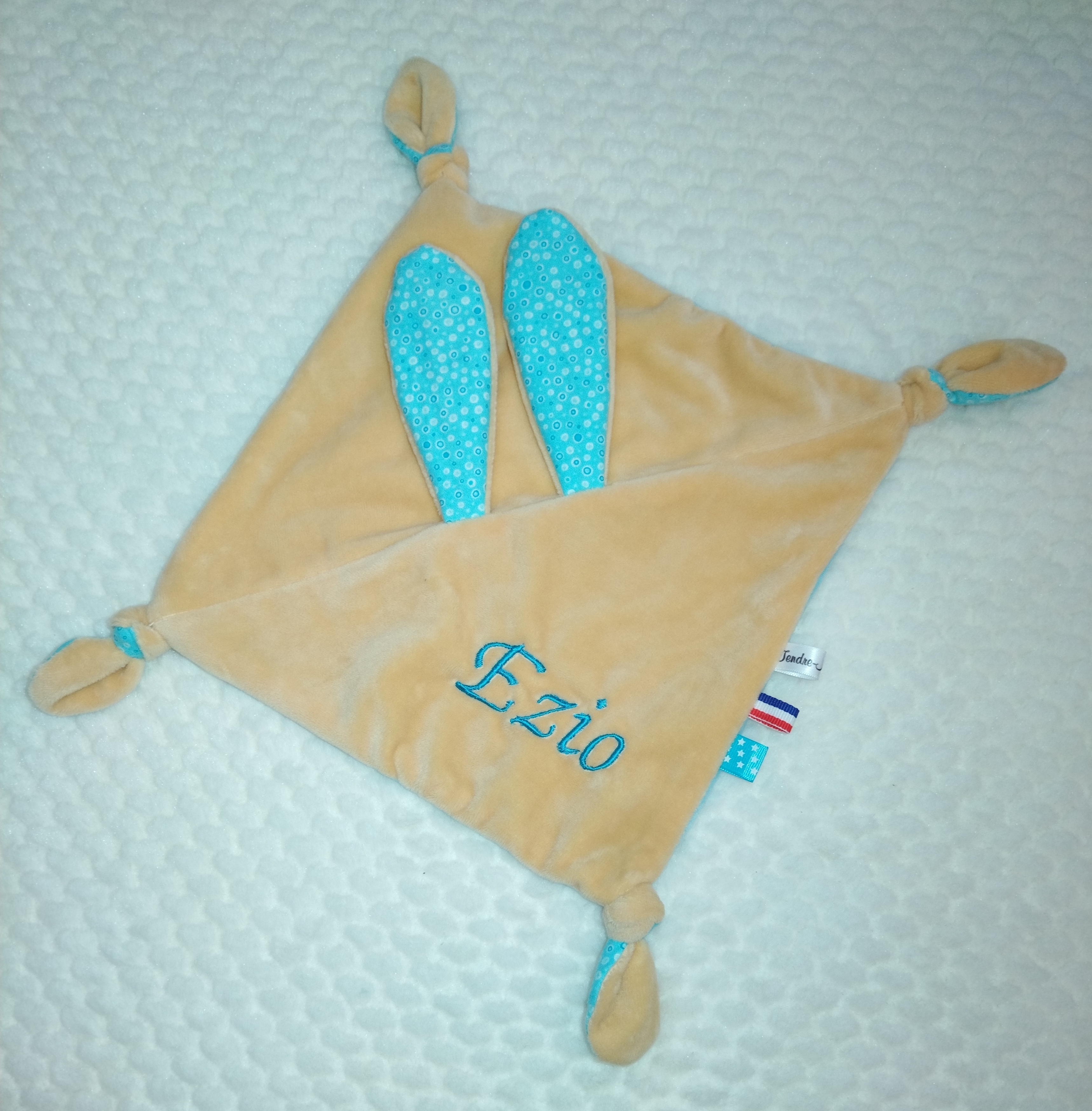 Tendre doudou girafon brodé