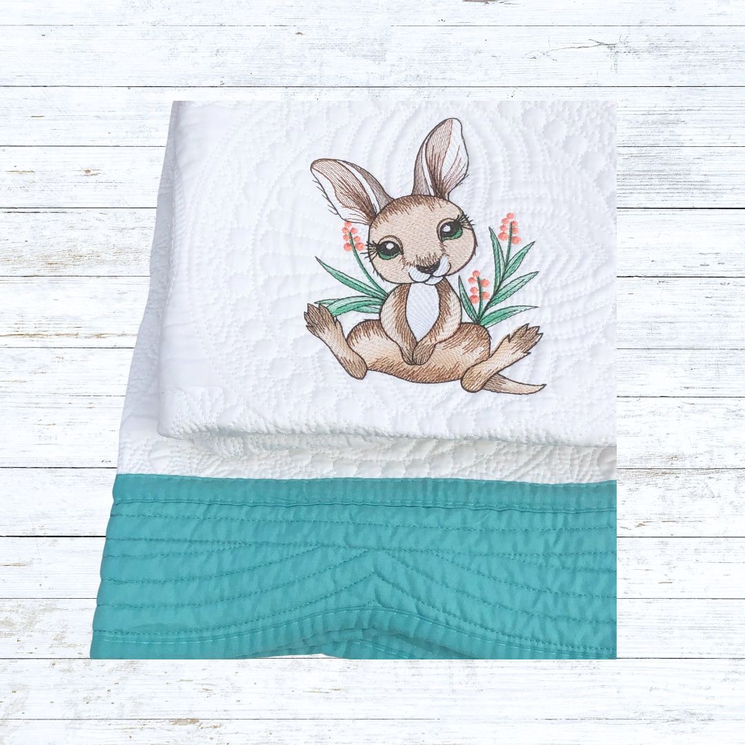 Personalised embroiderd baby quilt teal border