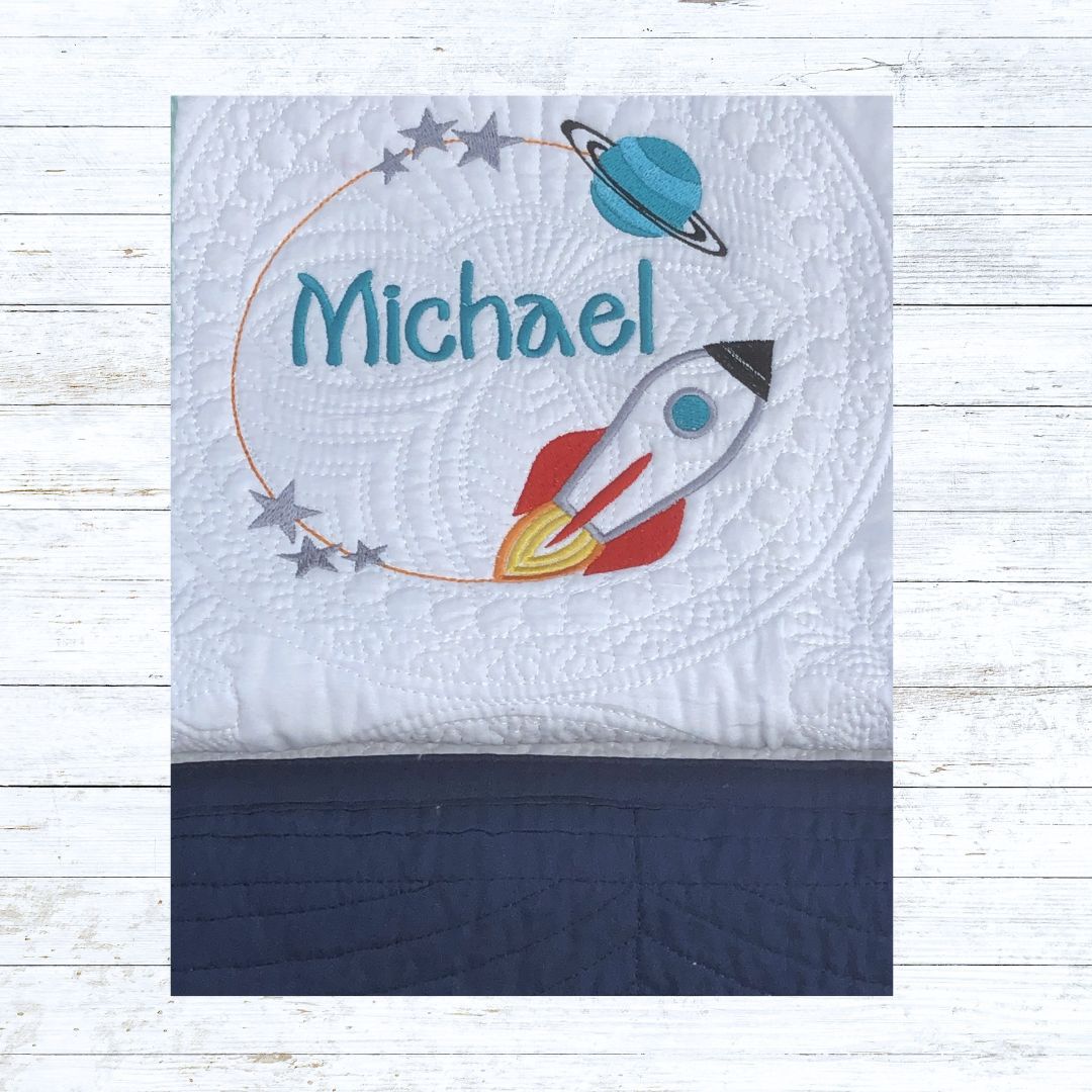 Personalised embroiderd baby quilt navy blue border