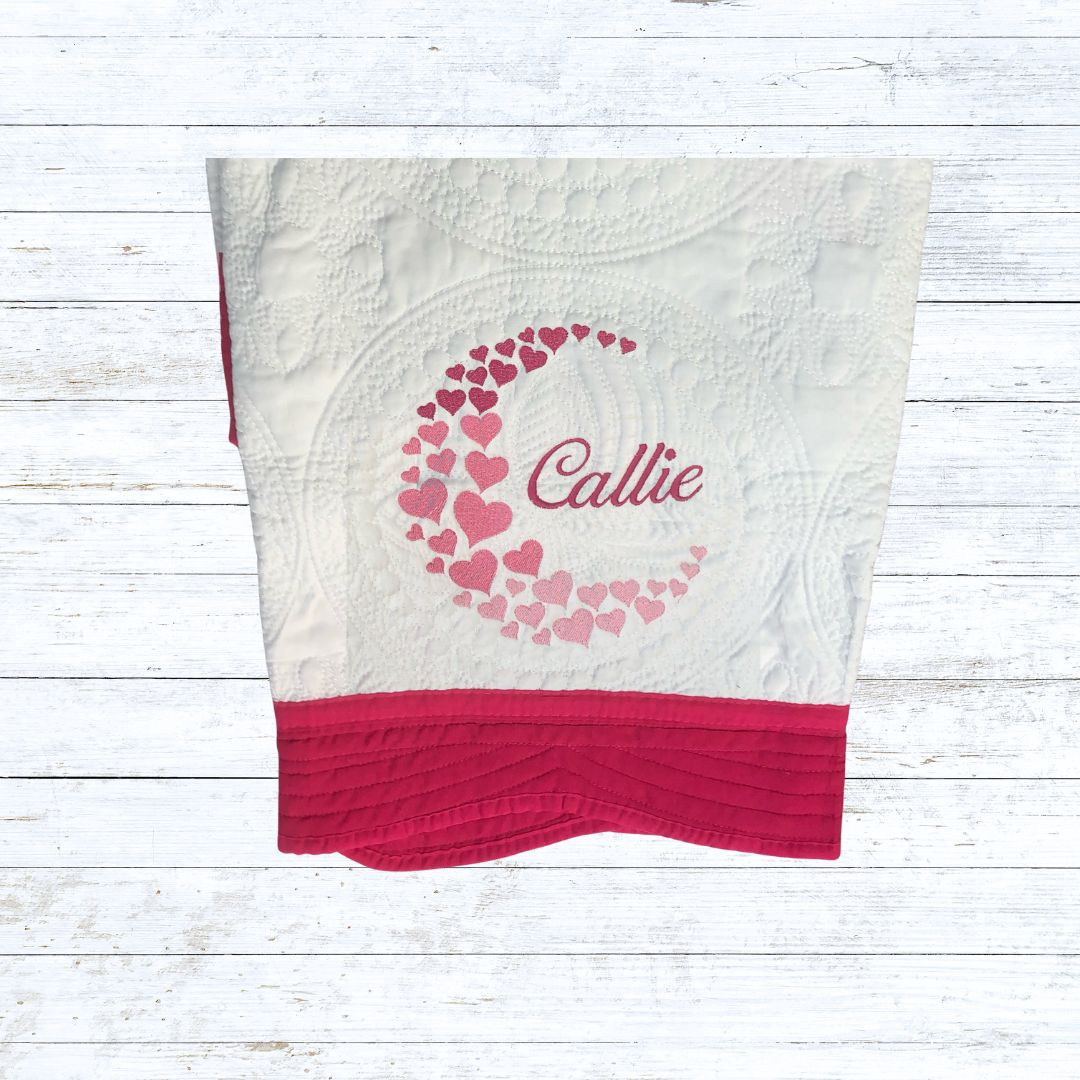 Personalised embroiderd baby quilt hot pink border