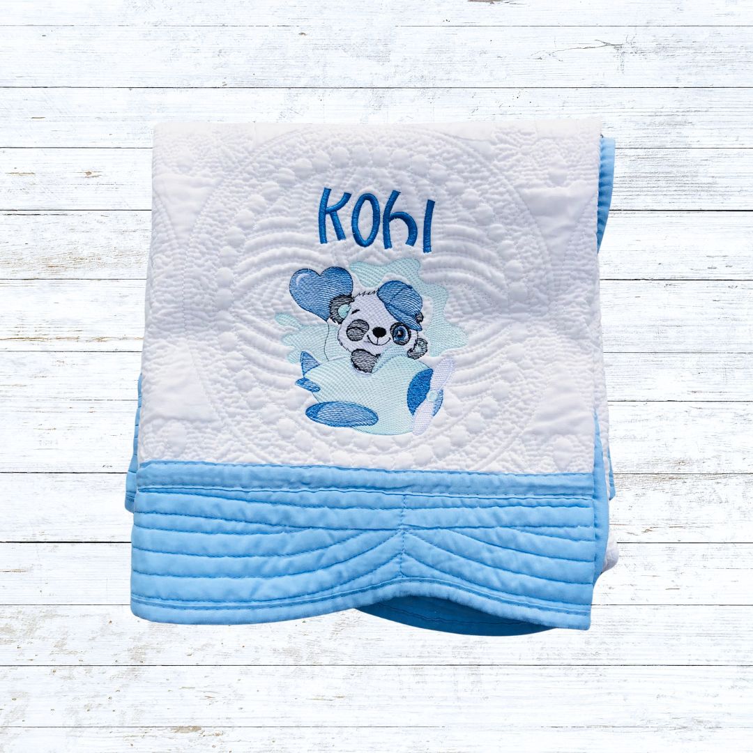 Personalised embroiderd  baby quilt light blue  border