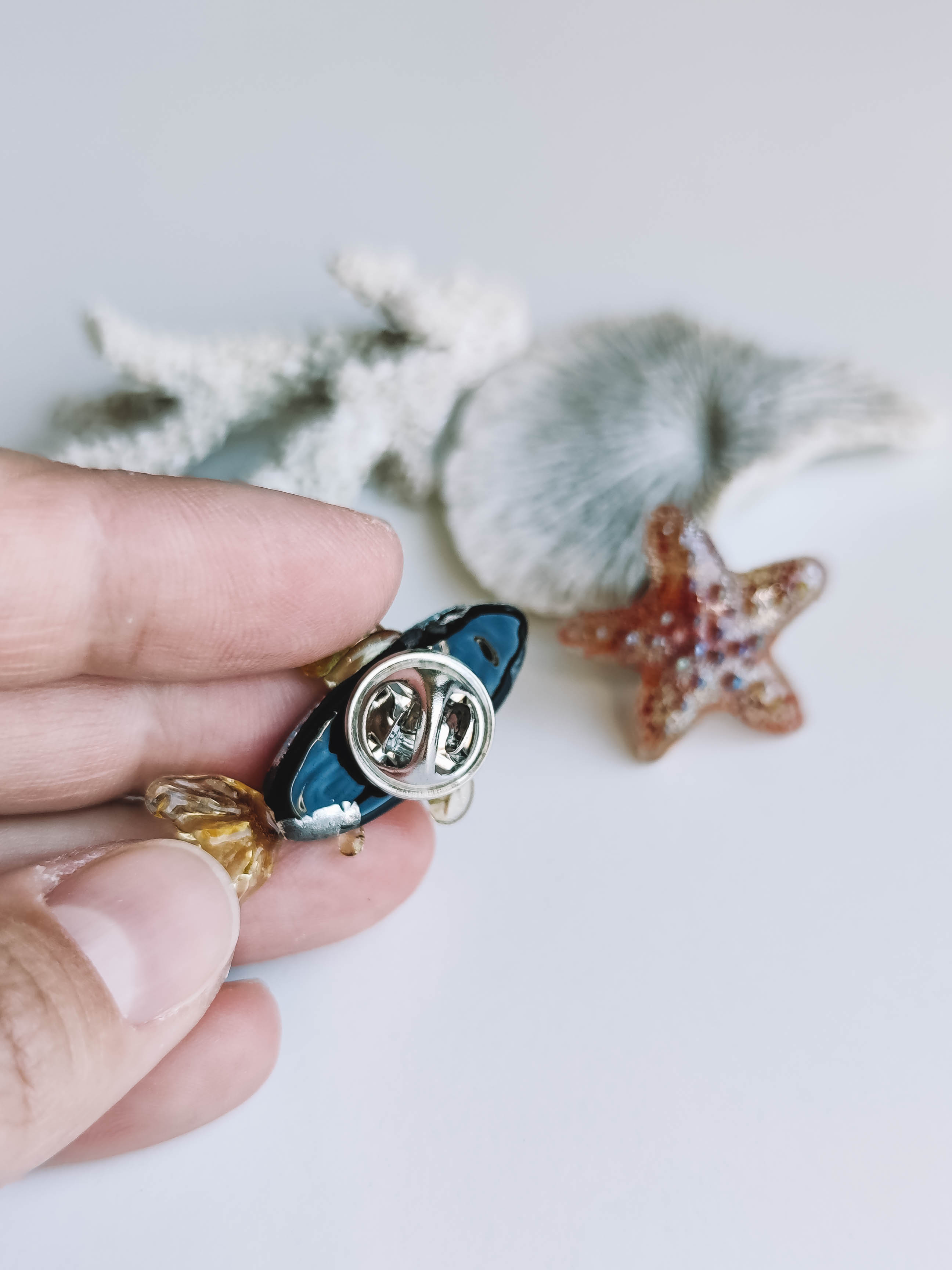 Fish badge brooch