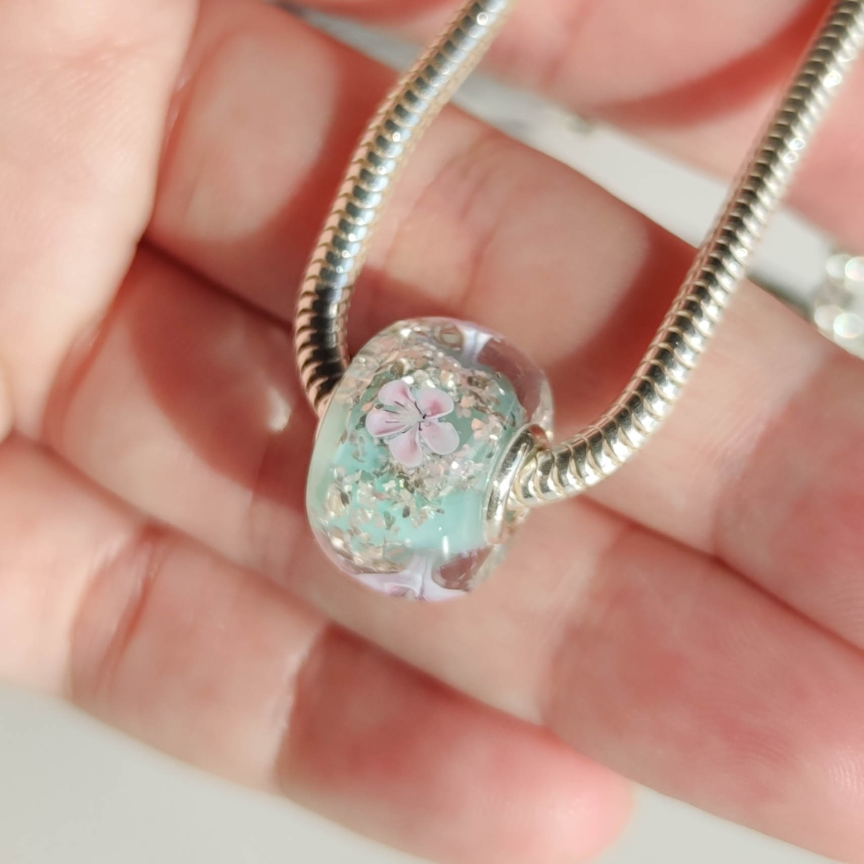 Sakura on green, silver flakes