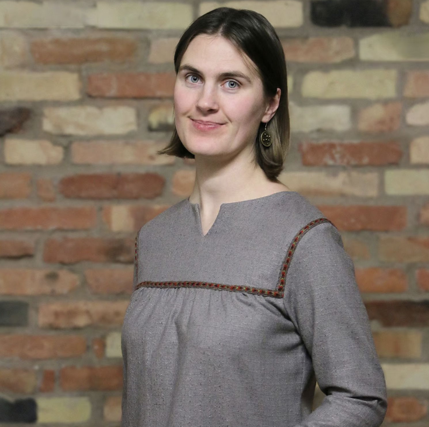 Thin woolen shirt with a woven decorative band