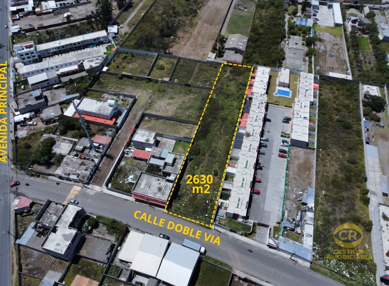 Terreno 2630 m2 en Calderón, Sector Comercial, En Calle Principal
