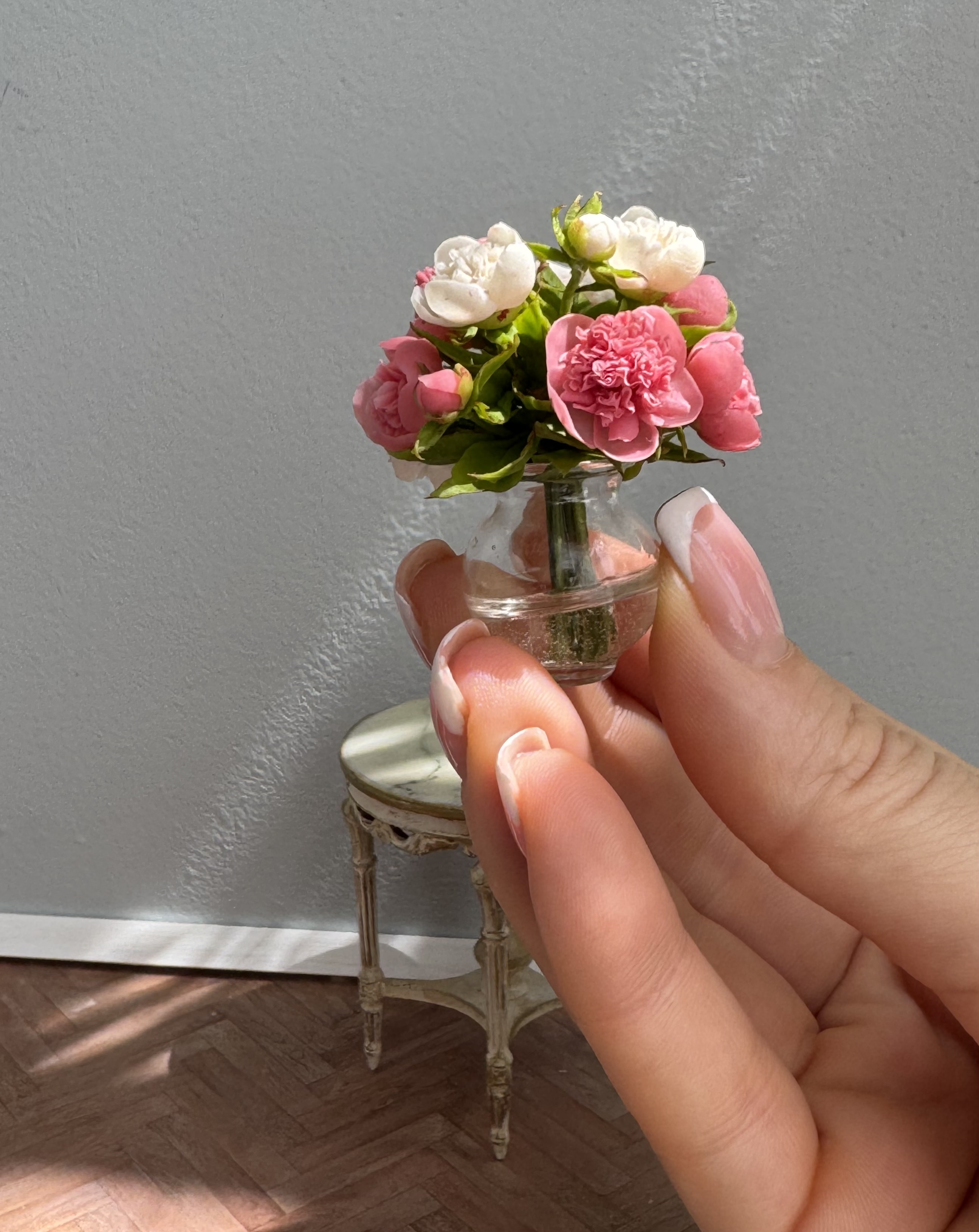 Peonies bouquet in glass vase