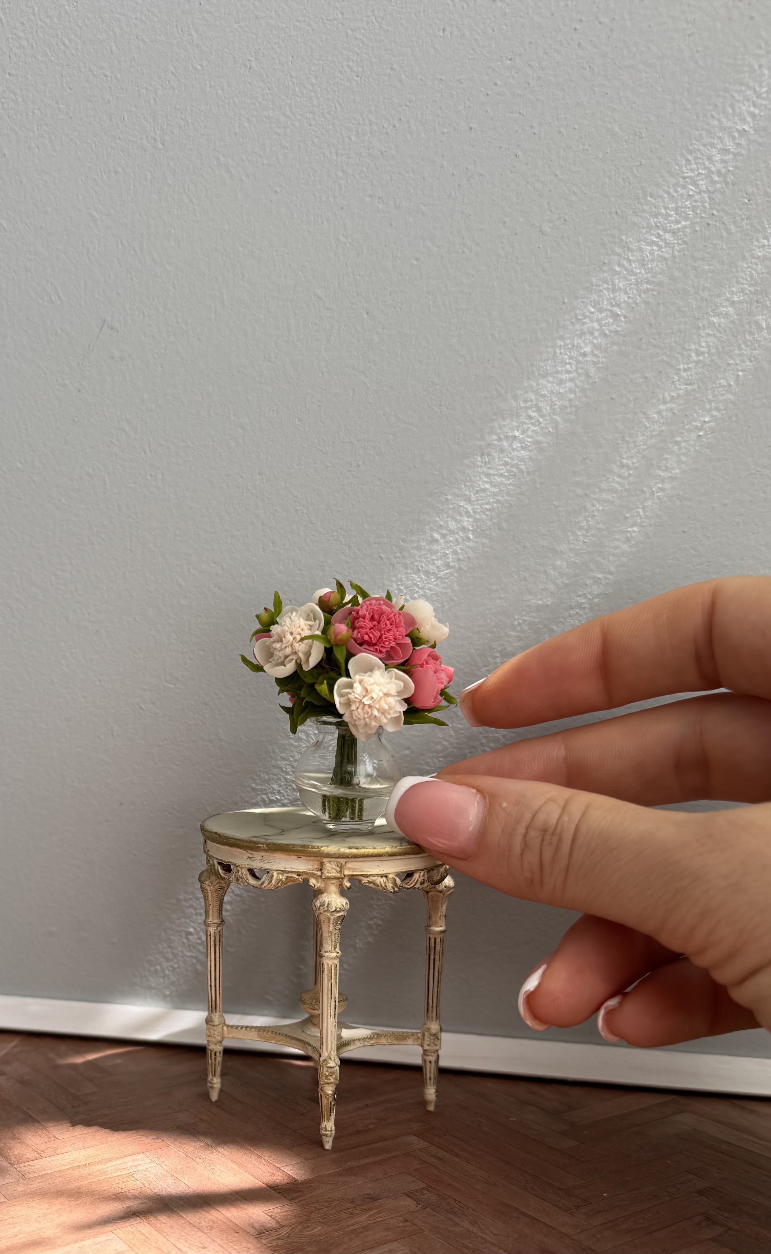 Peonies bouquet in glass vase