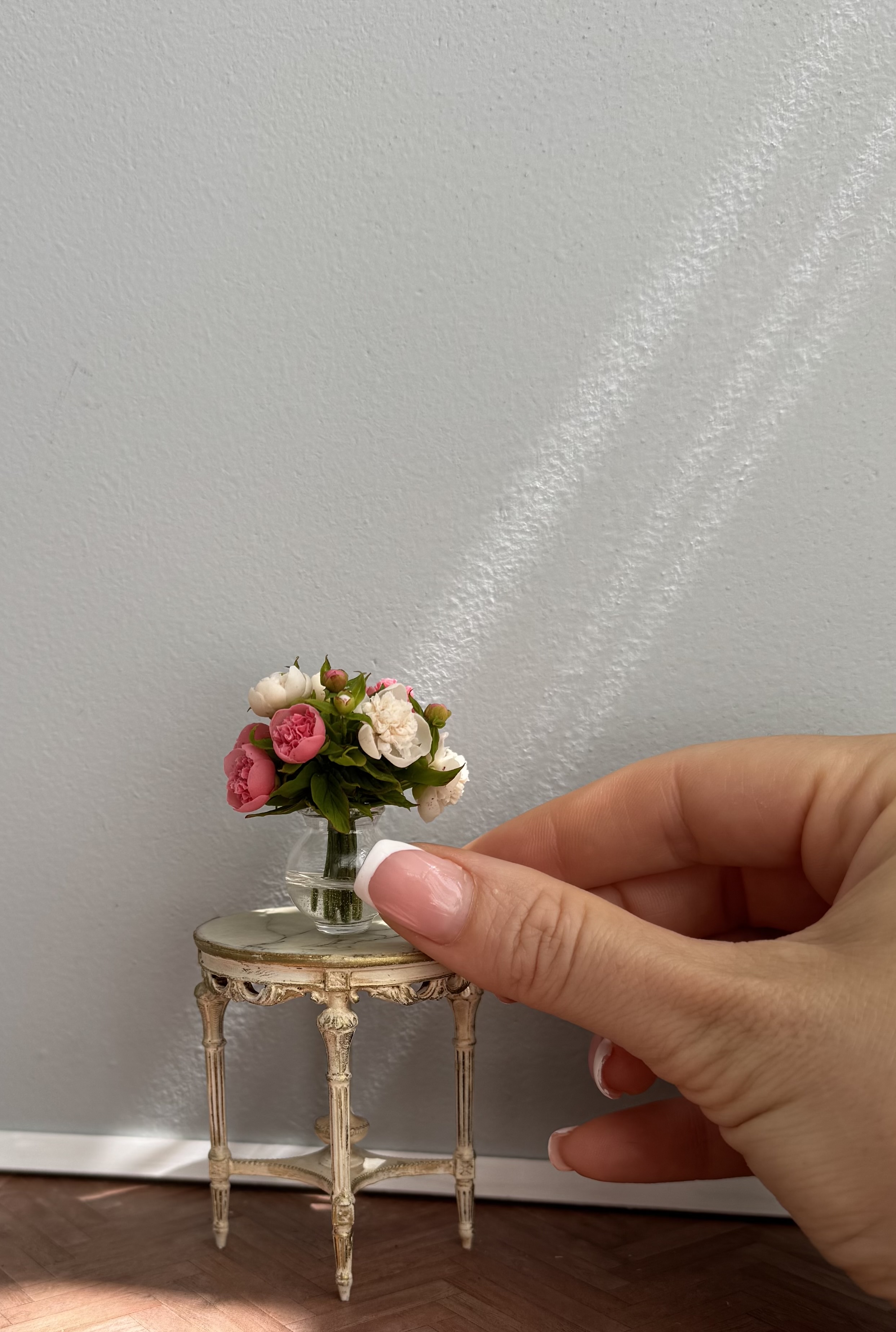 Peonies bouquet in glass vase