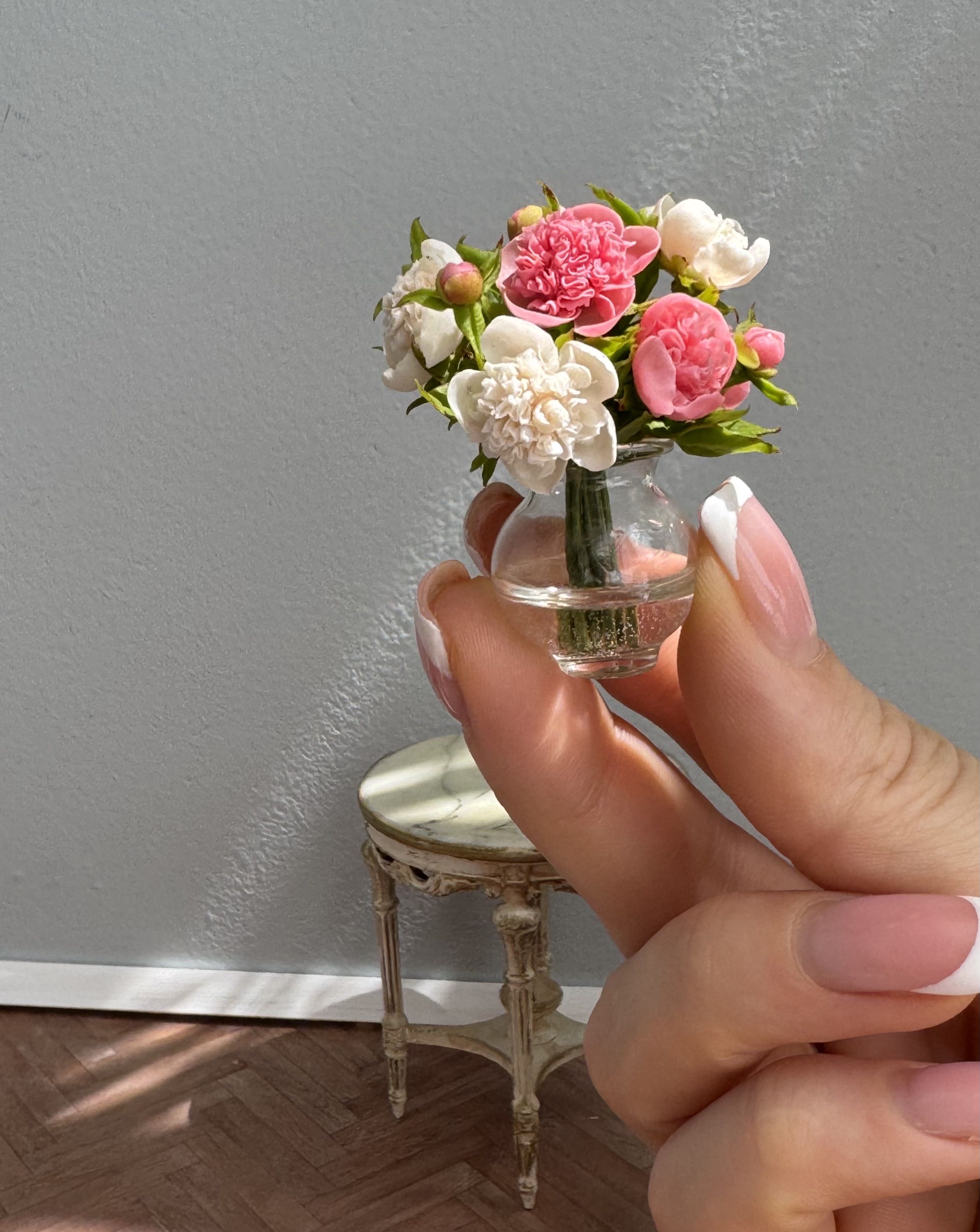 Peonies bouquet in glass vase