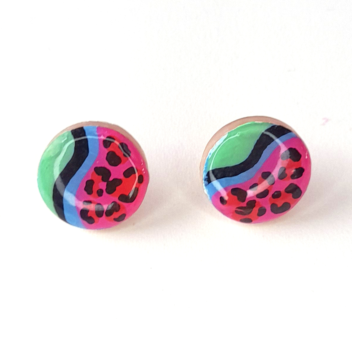 KIRA statement studs in green and hot pink