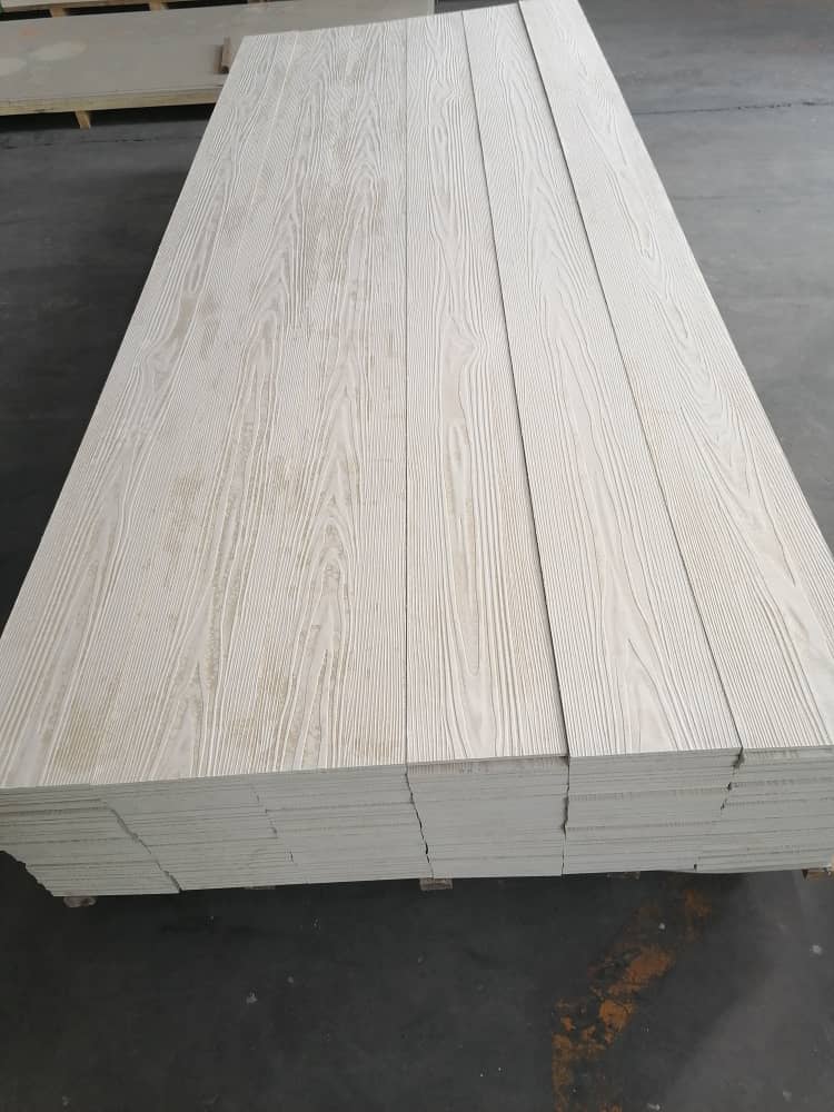 Wood-textured composite planks