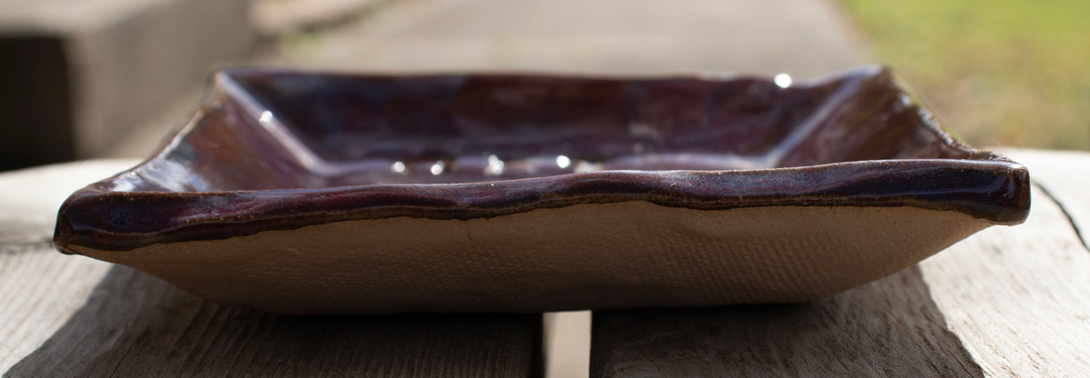Handbuilt stoneware imprinted soap dish, Get 'Em Clean! pattern. 