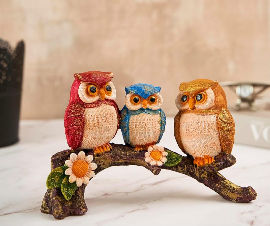Owls on branch
