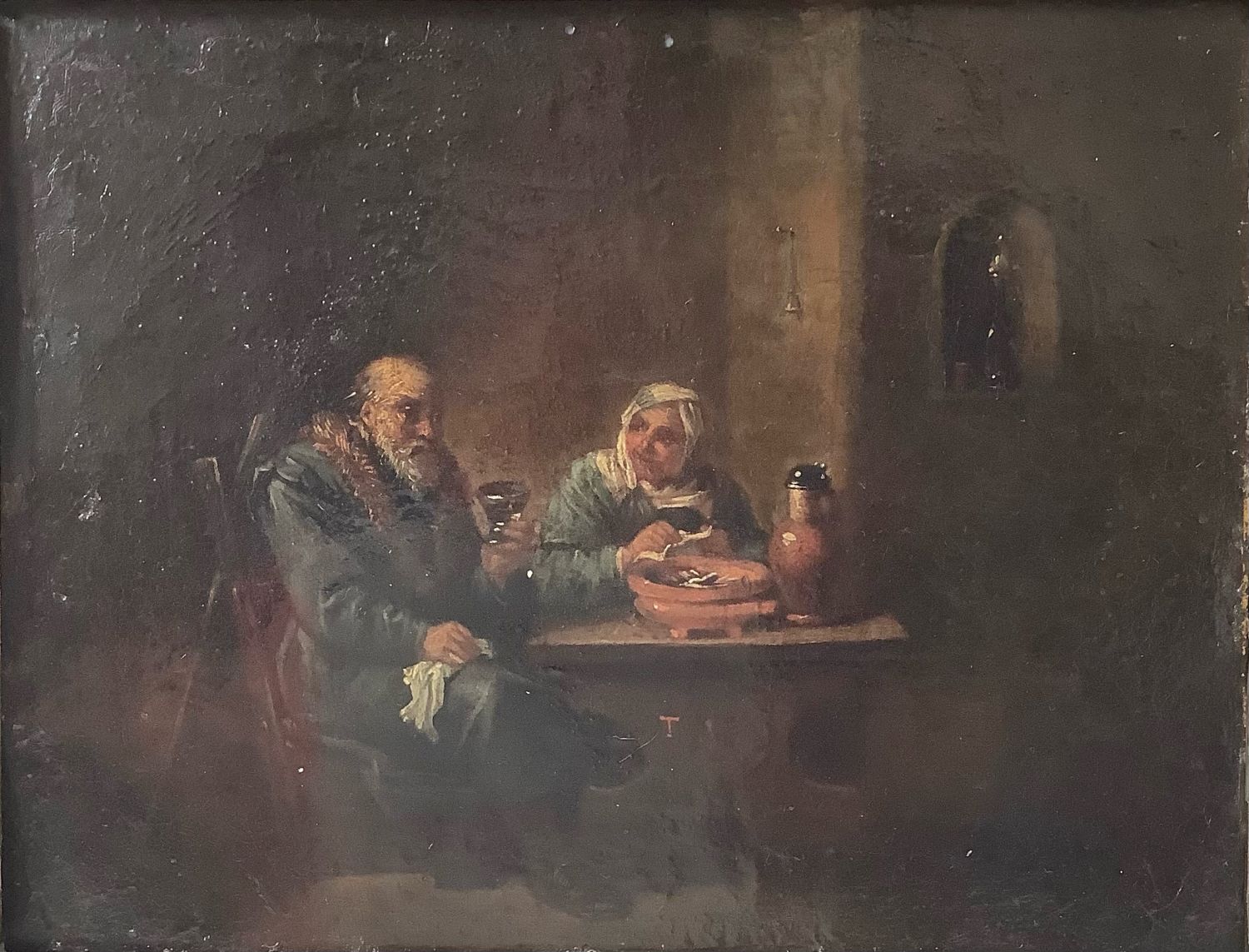 Scène d'intérieur dans le goût de Teniers. Huile sur cuivre. 18,5 x 24 cm. Signée d'un T rouge au centre du tableau.