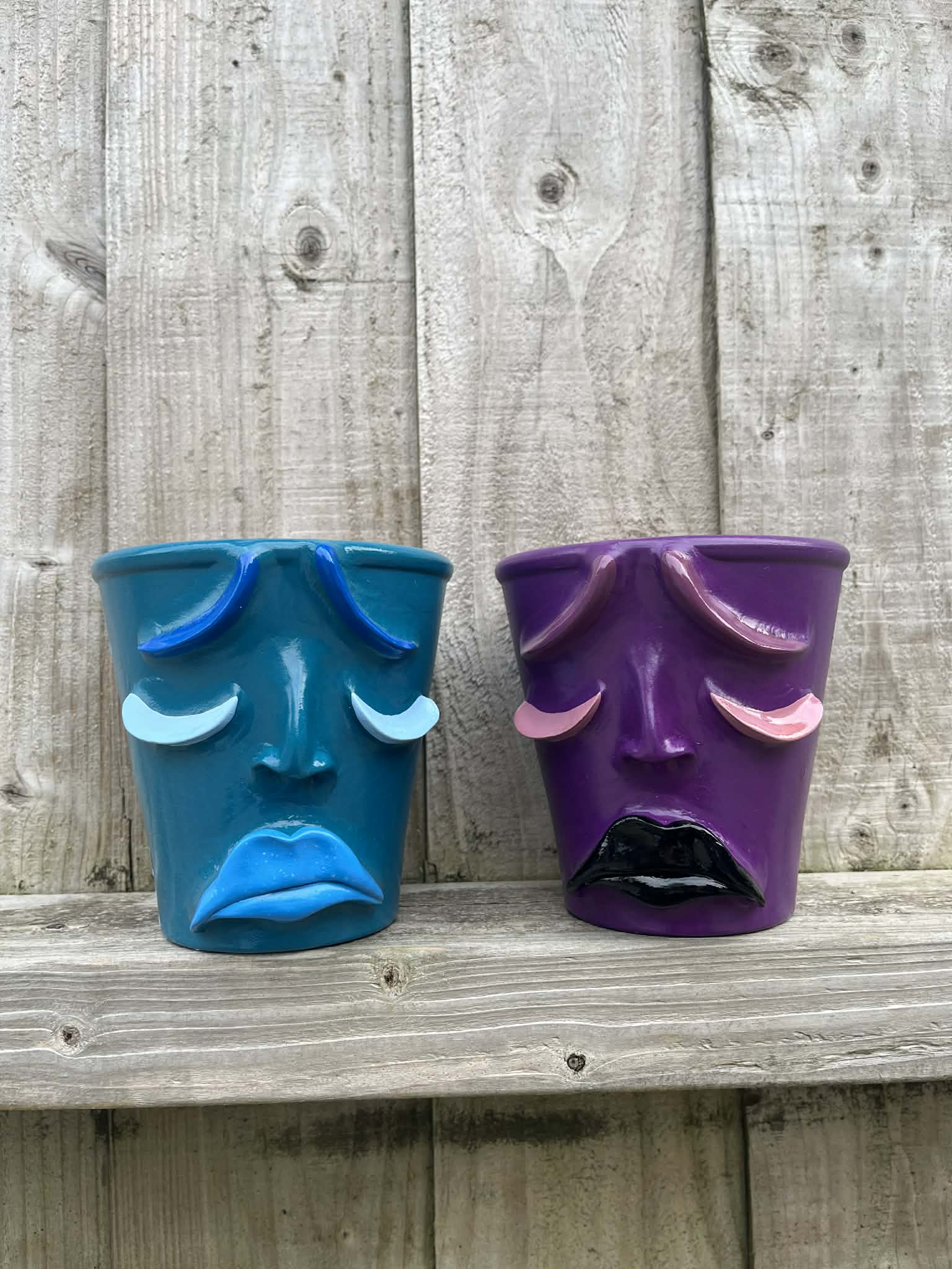 Pair of Small Sad Face Pots
