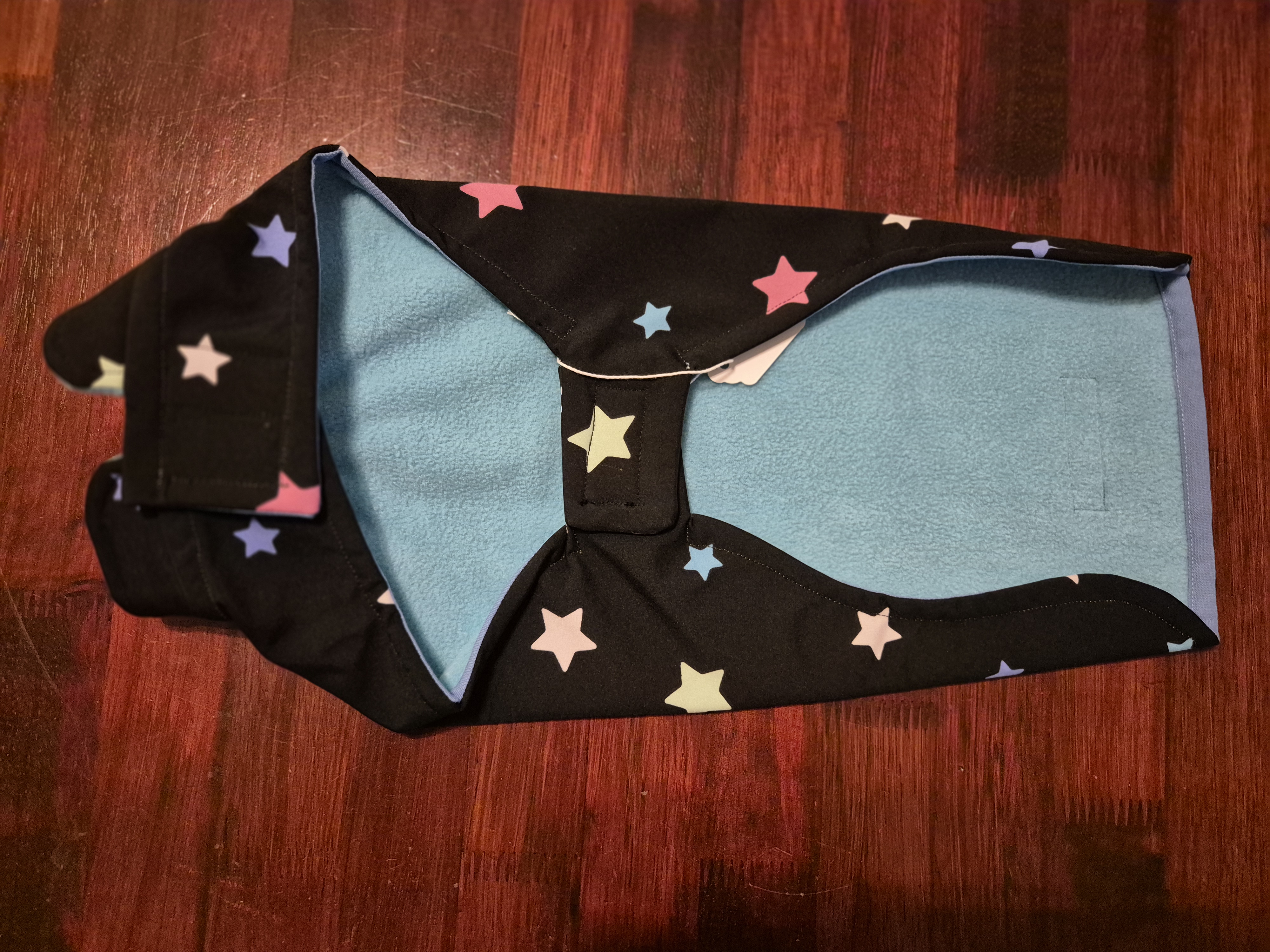 Coloured stars on Black Background Water Resistant fleece lined coat