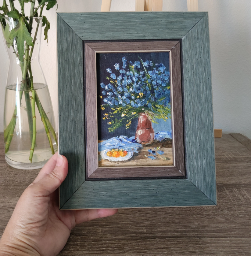 forget-me-nots, Blue flowers in striped vase