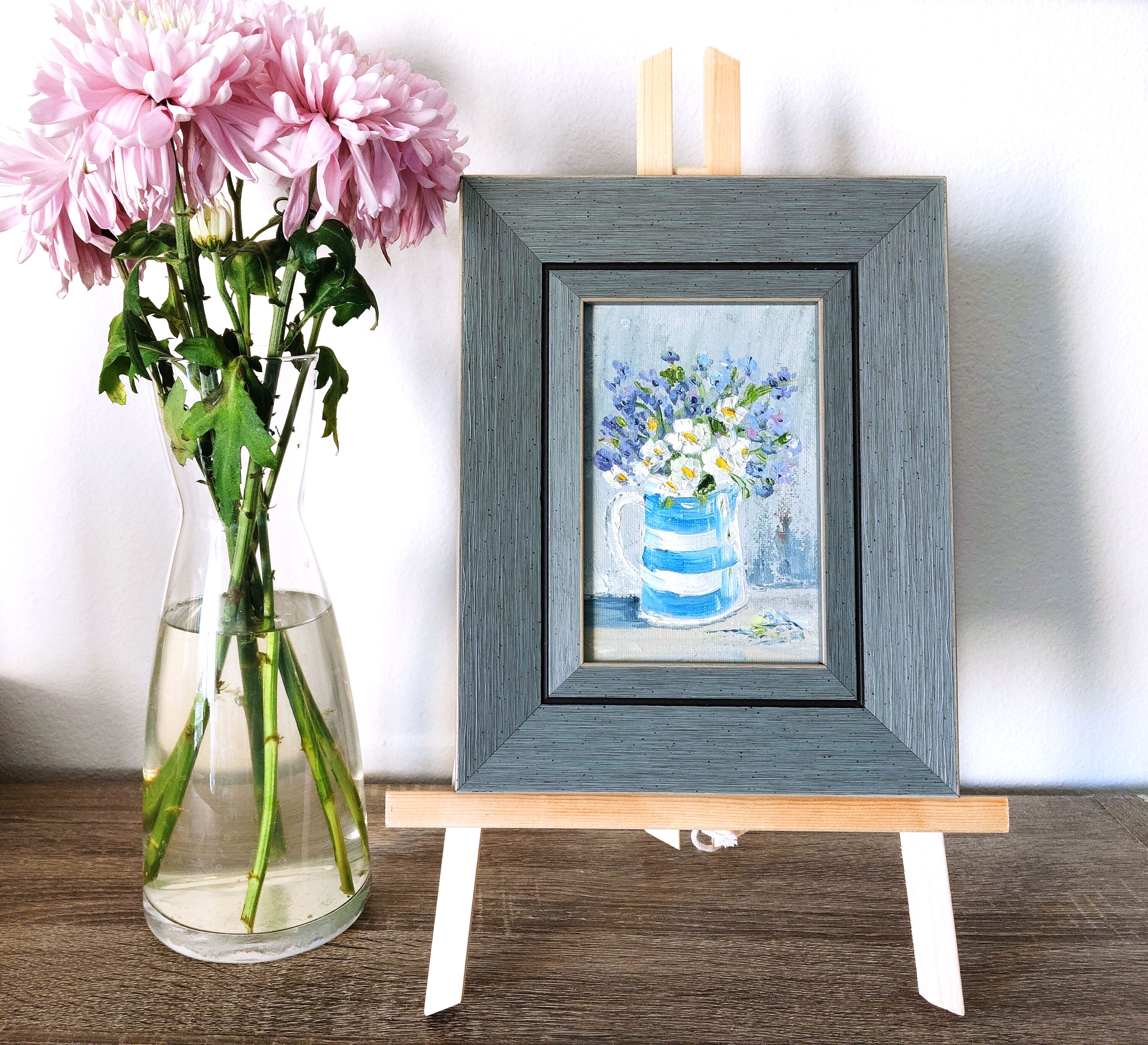 White flowers in a striped vase.