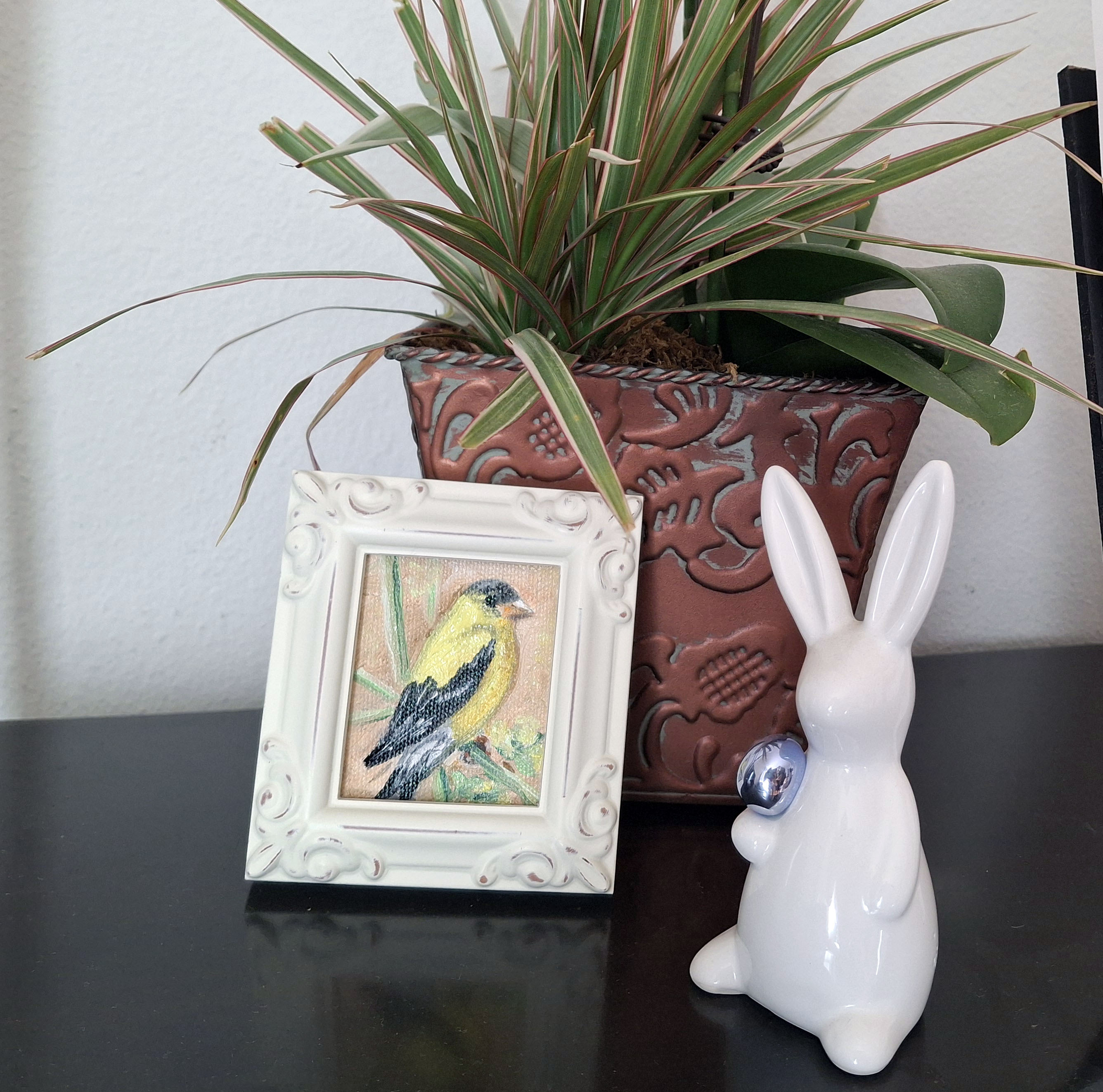 Yellow bird in vintage frame