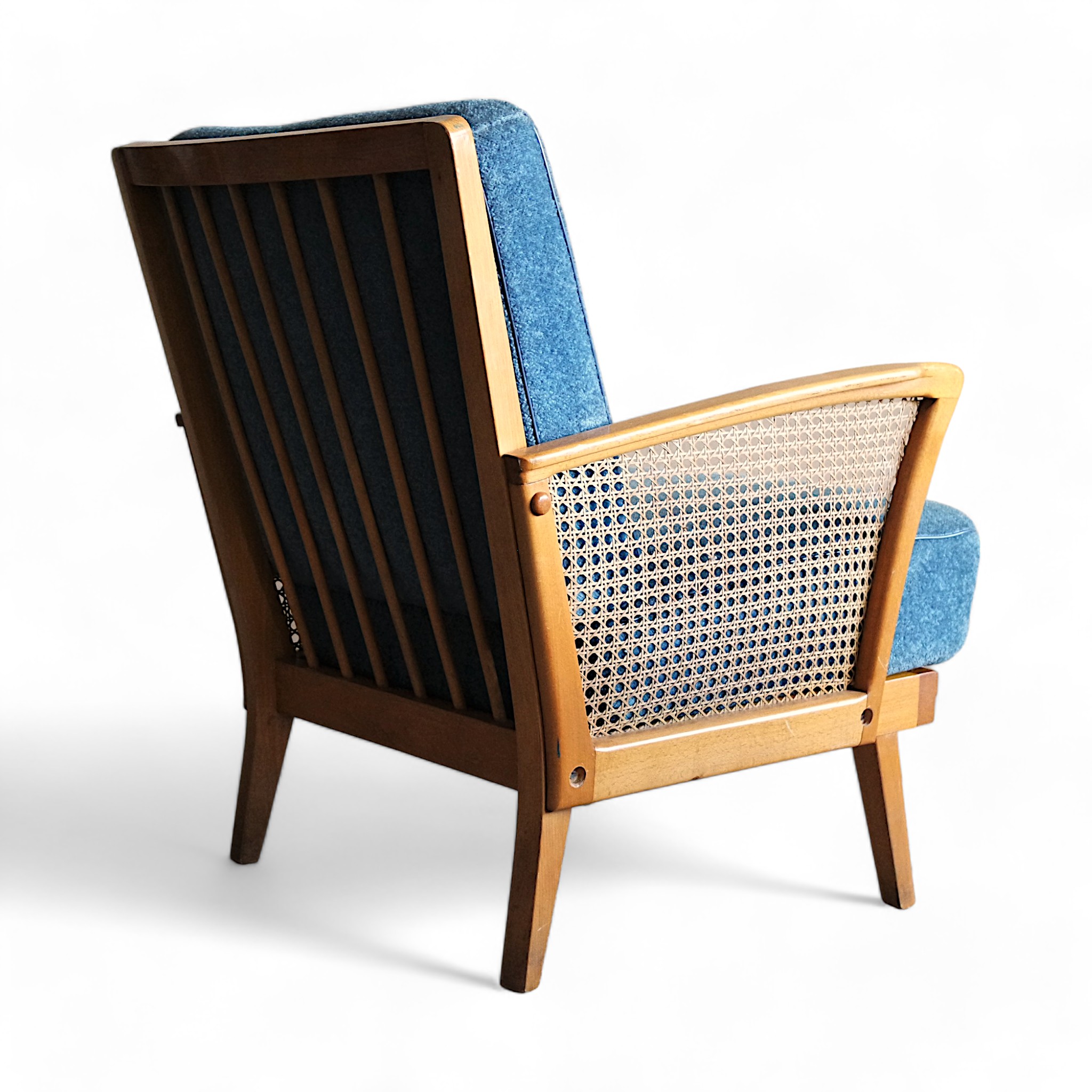 Vintage lounge chair with rattan armrests