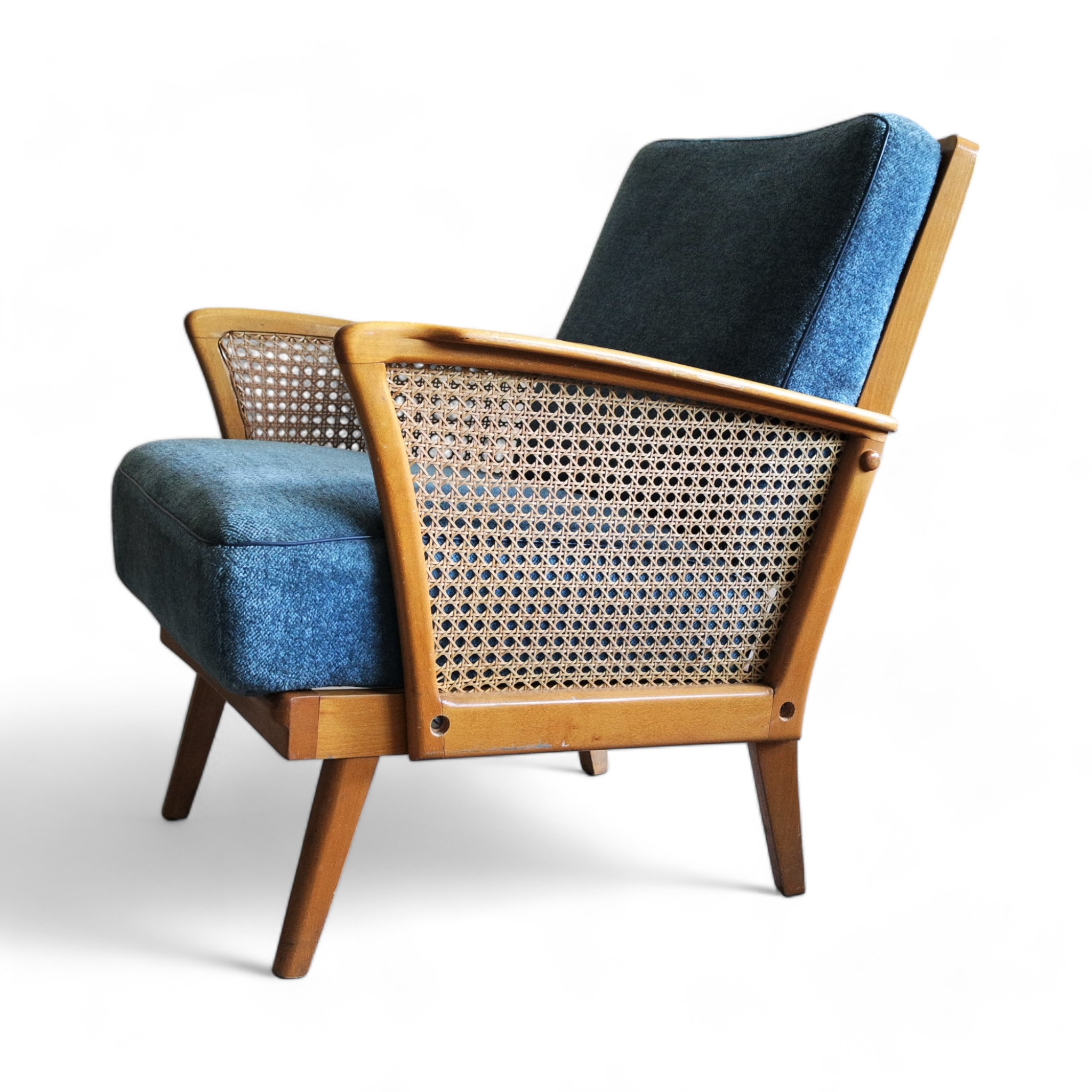 Vintage lounge chair with rattan armrests