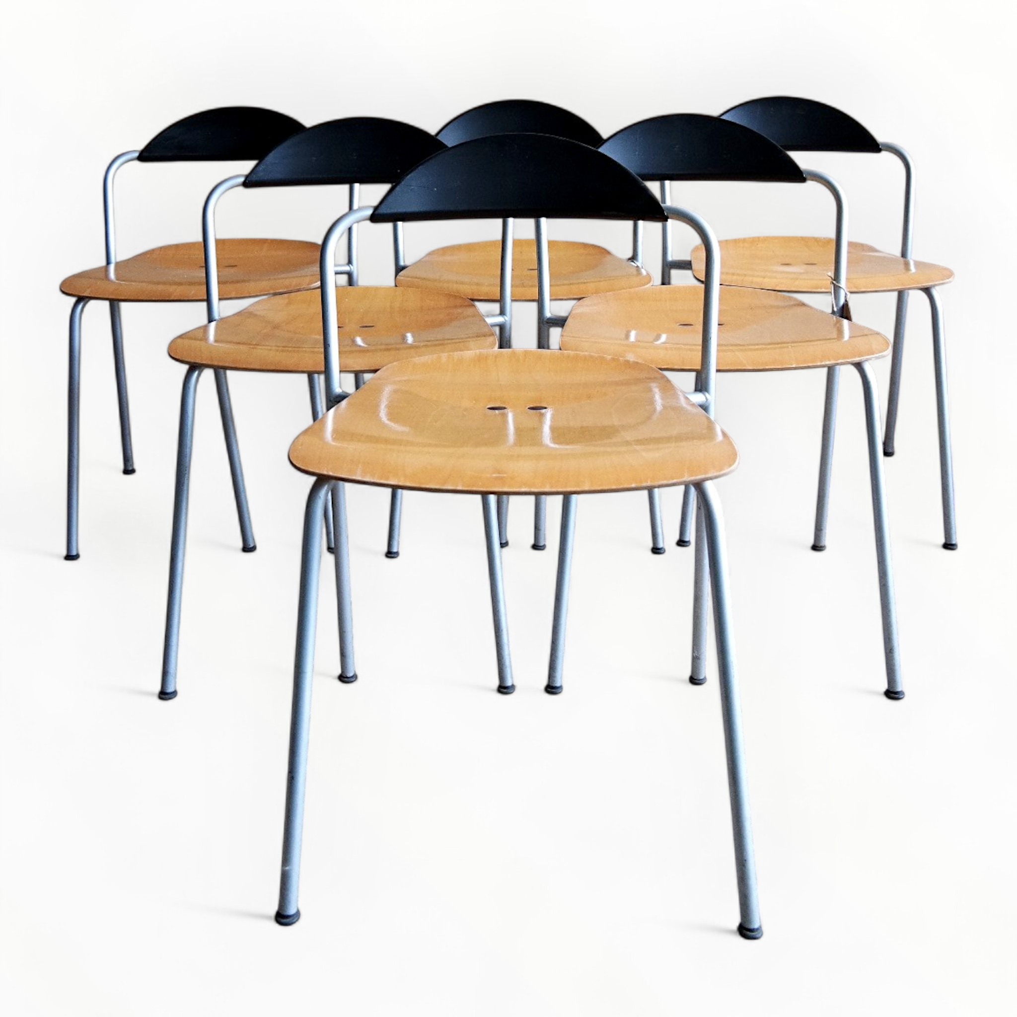 Stackable chairs by Vico Magistretti