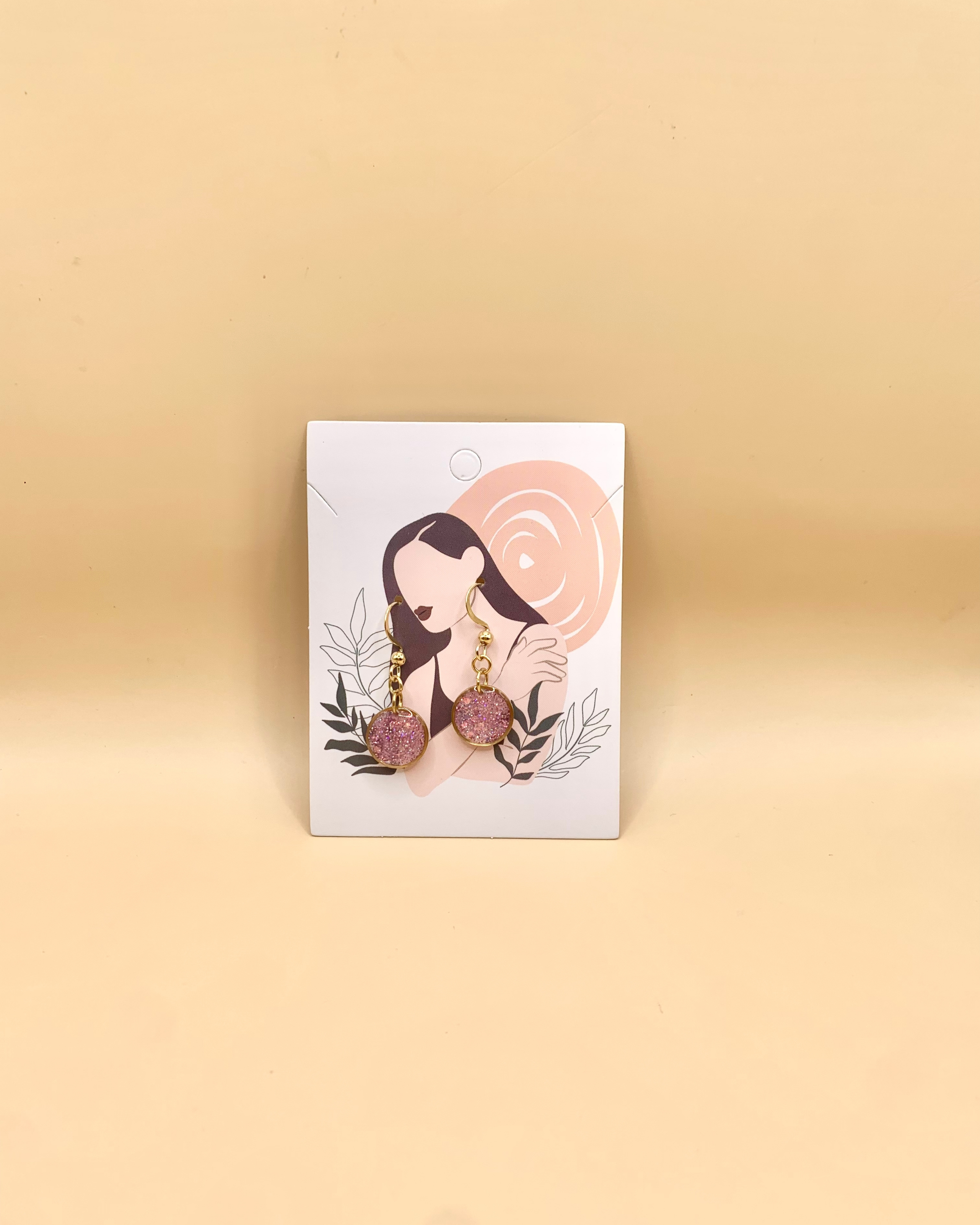 Pendientes de aro dorados con brillo rosa