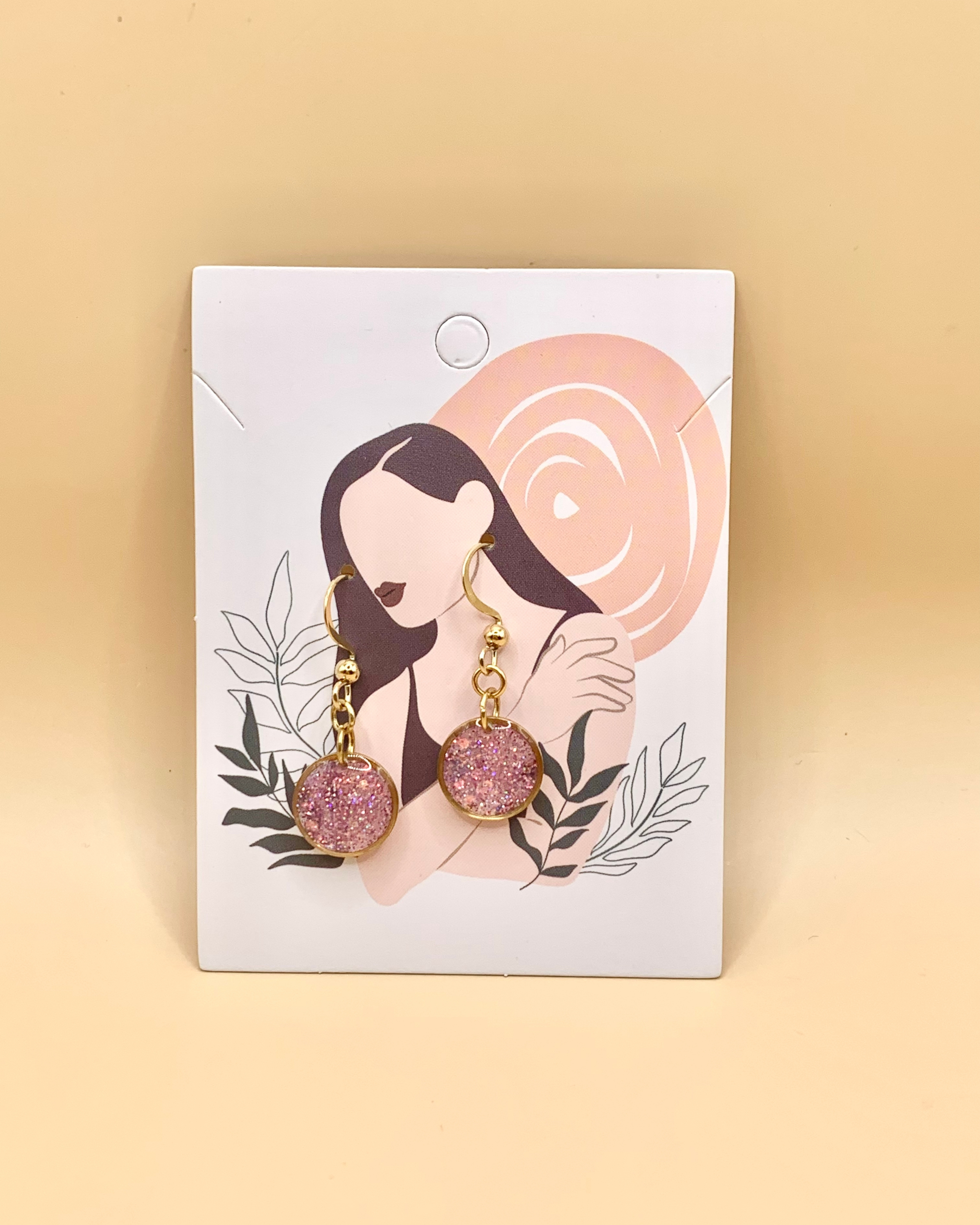 Pendientes de aro dorados con brillo rosa