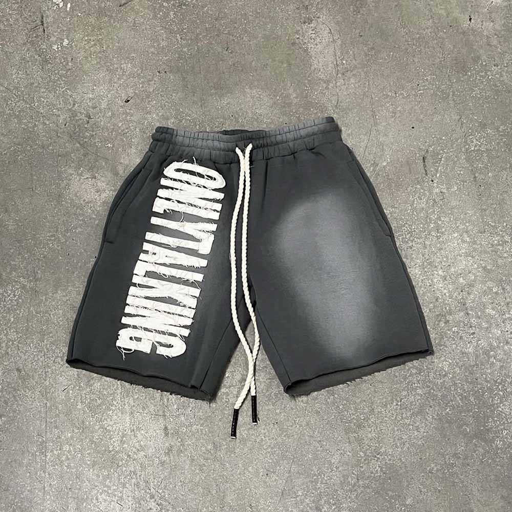 Sunfaded shorts with distressed embroidery