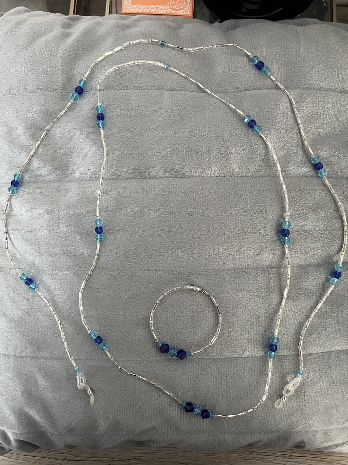 CORDON A LUNETTES COLLIER BRACELET TRANSPARENT ET BLEU