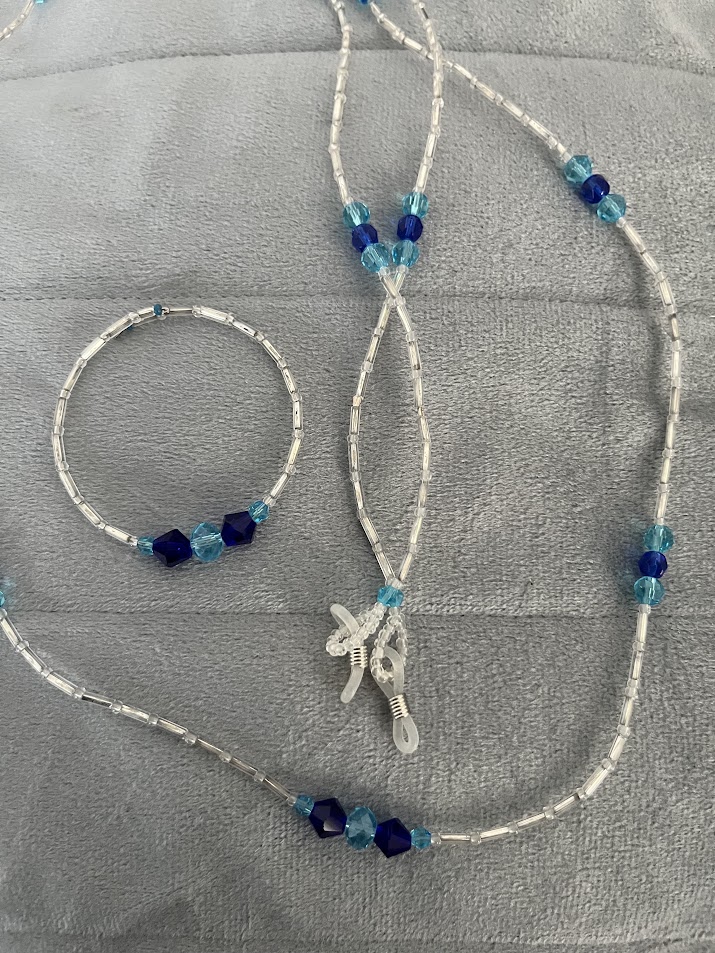 CORDON A LUNETTES COLLIER BRACELET TRANSPARENT ET BLEU