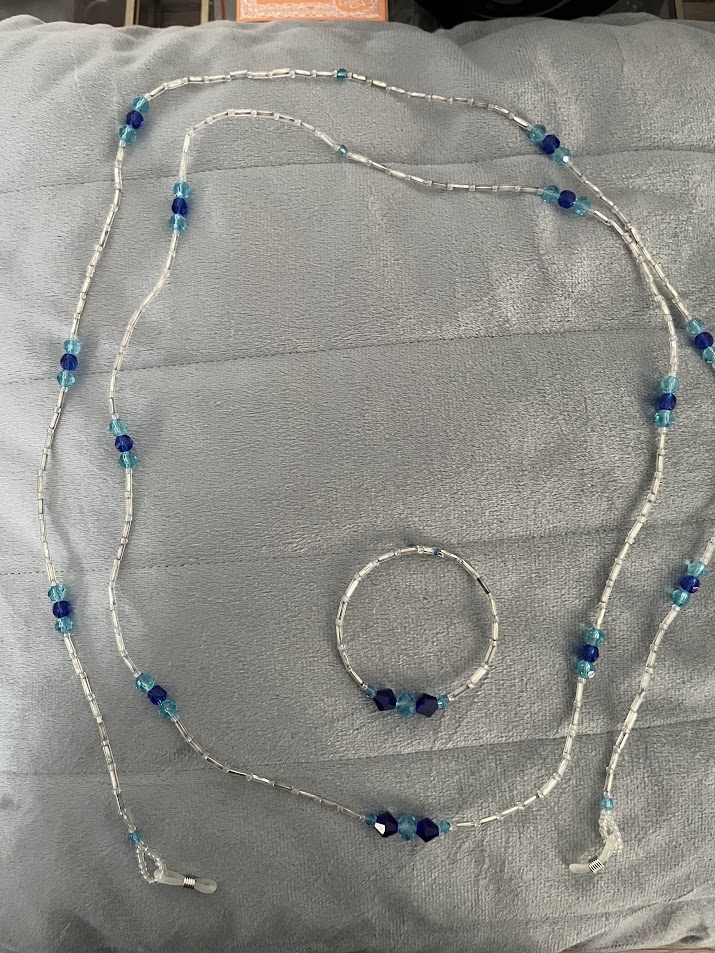 CORDON A LUNETTES COLLIER BRACELET TRANSPARENT ET BLEU