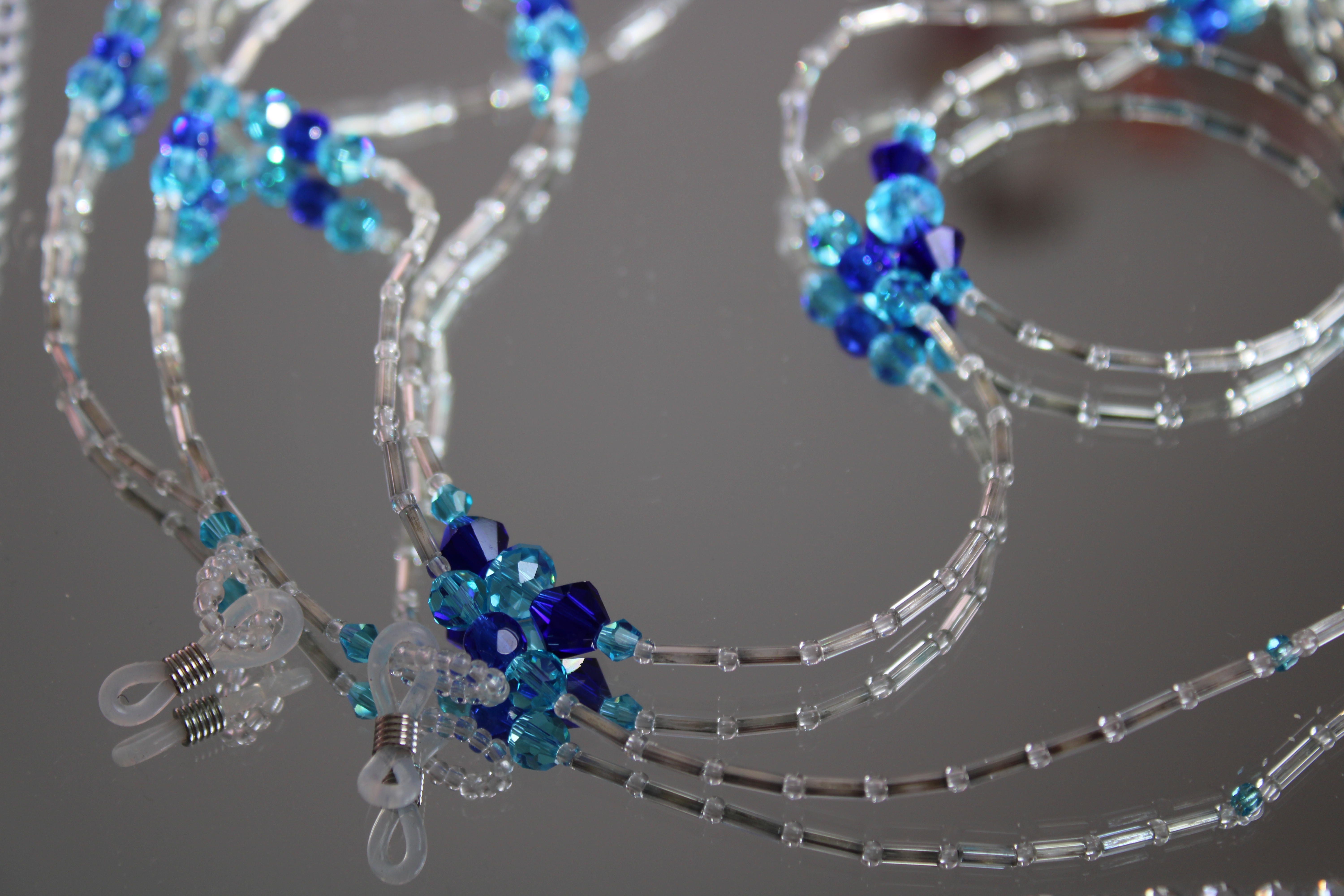 CORDON A LUNETTES COLLIER BRACELET TRANSPARENT ET BLEU