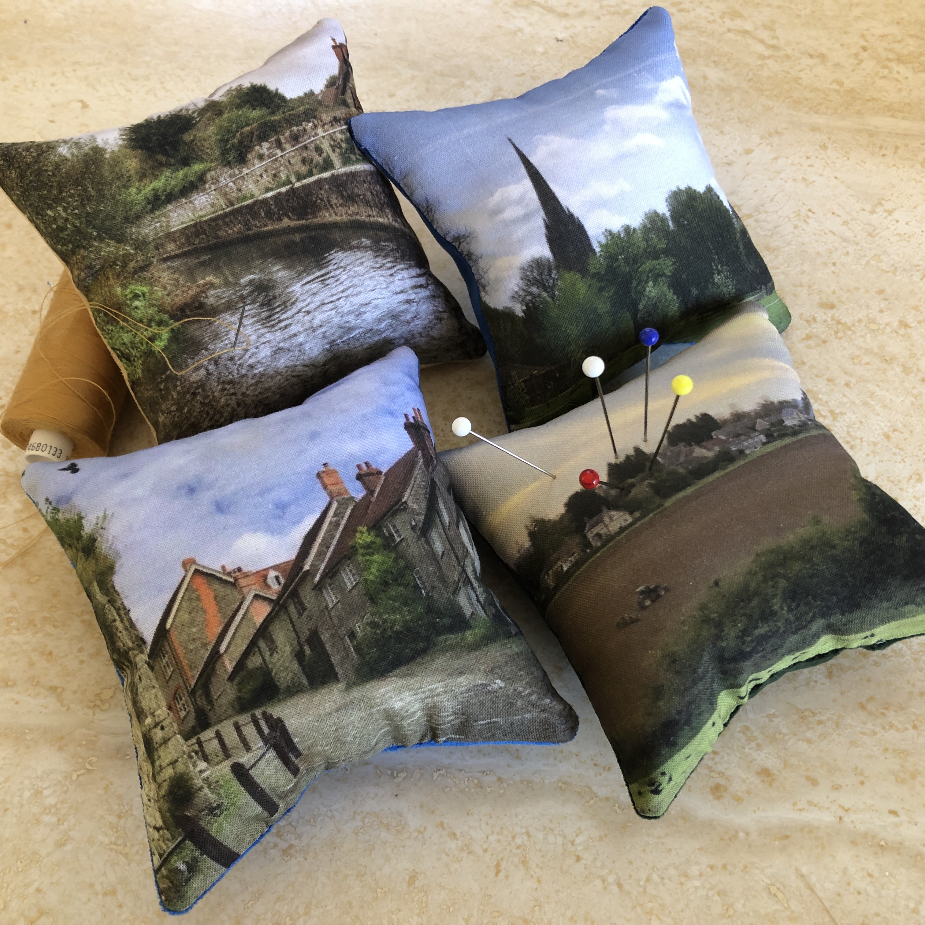 Velvet backed cotton pincushions printed with photos of Dorset/ Wiltshire landmarks