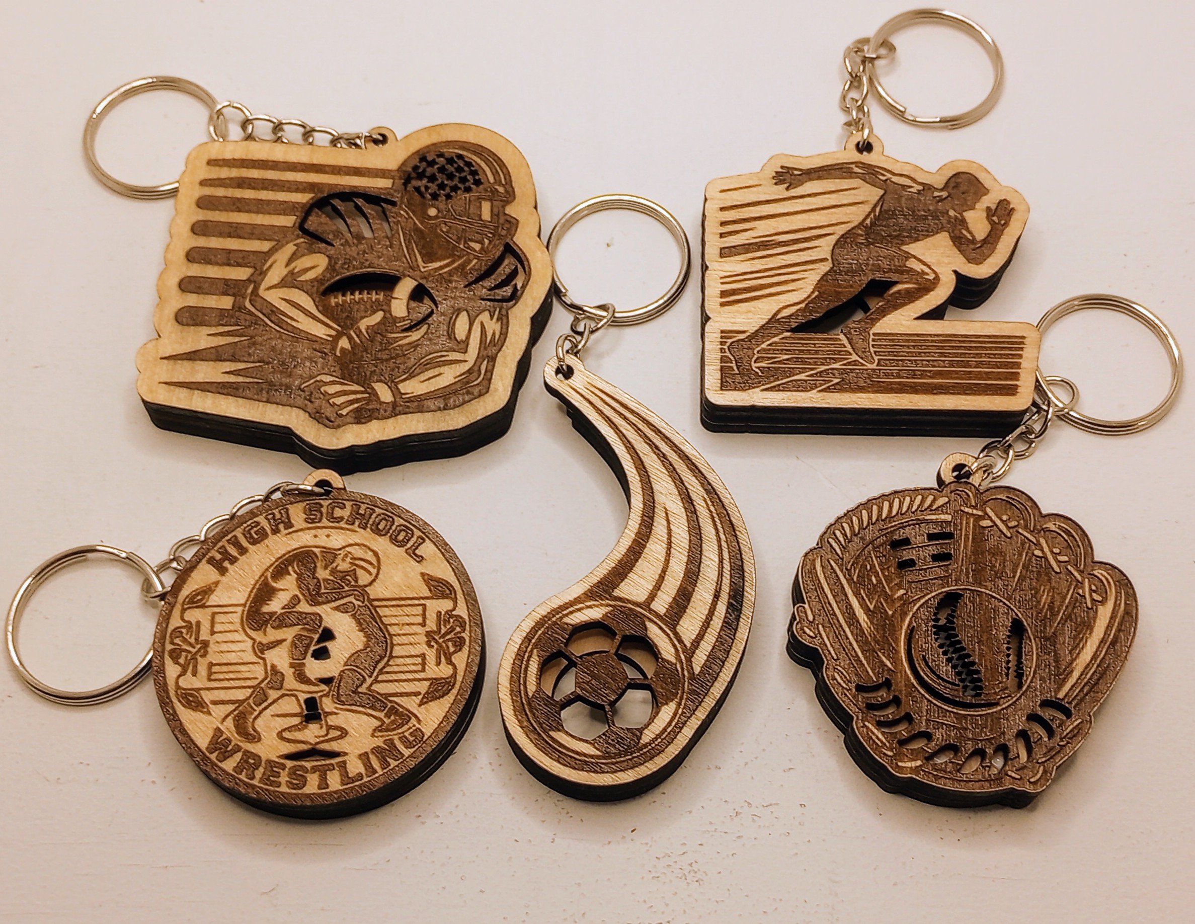 Sports themed wooden keychains, ready for essential oils....SVG ONLY
