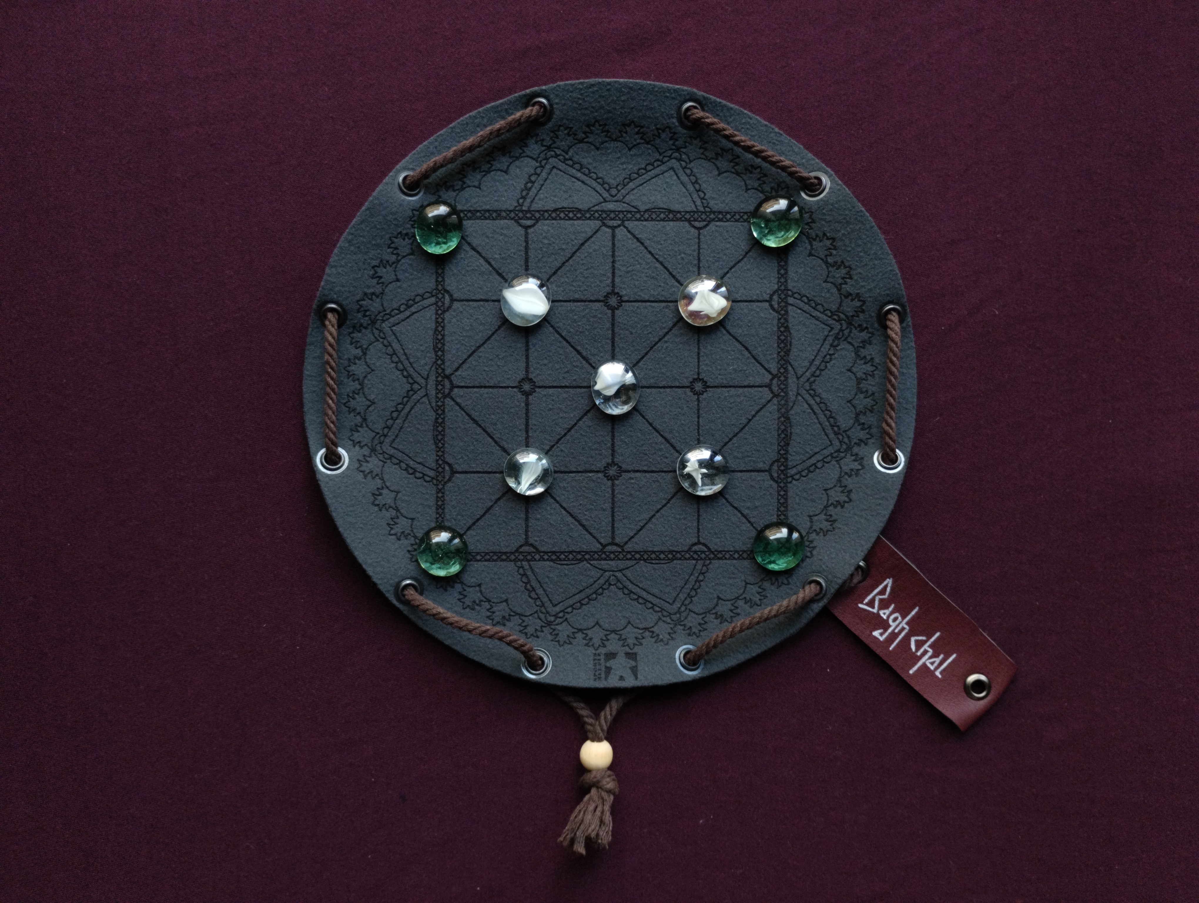 Bagh Chal Tigers and Goats nepalese ancient historic board game in dark green faux leather pouch, 22.5cm, 8.85inch diameter