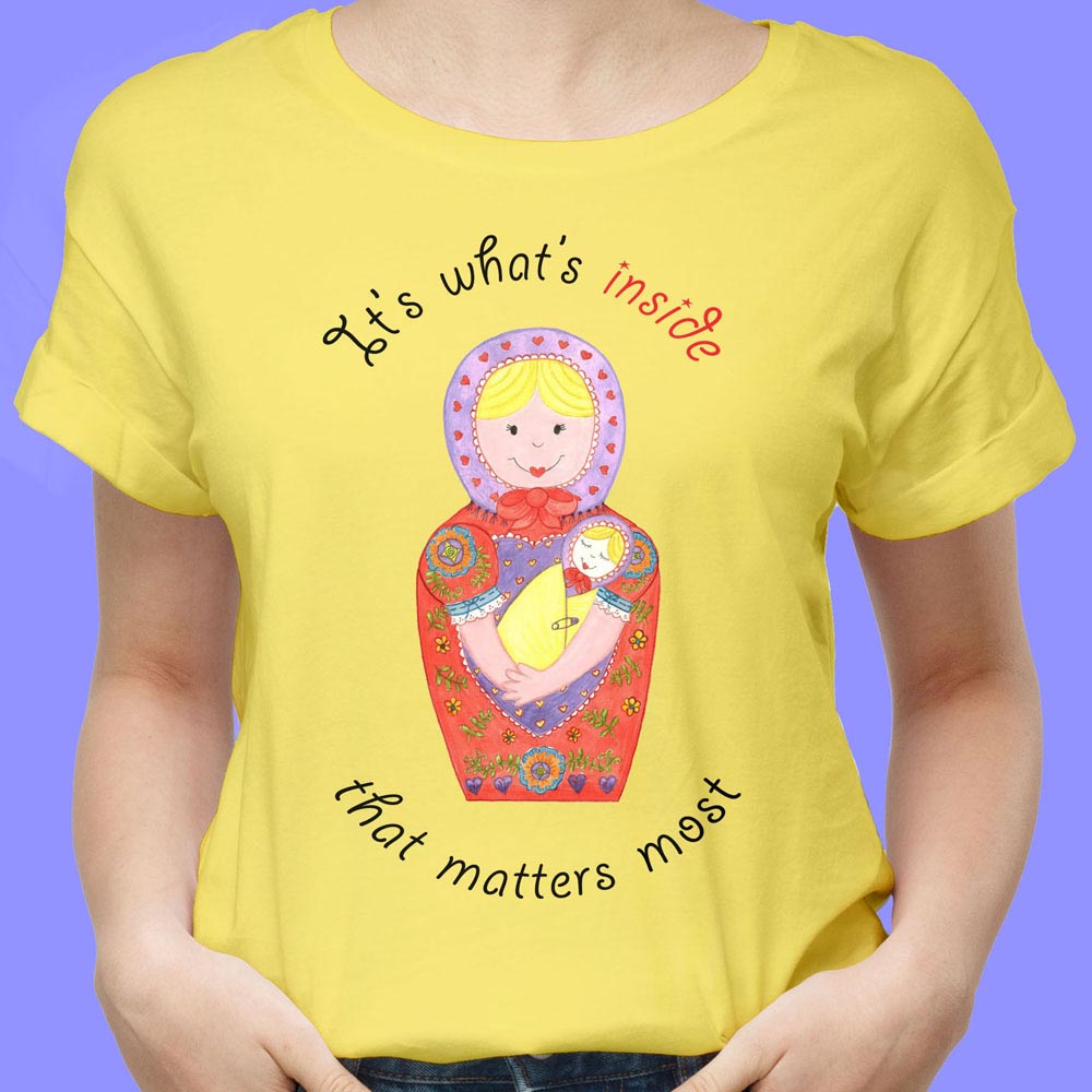 Womens Graphic Tees: Yellow T shirt “It’s what’s inside that matters most” Cotton T Shirt with Babushka Dolls