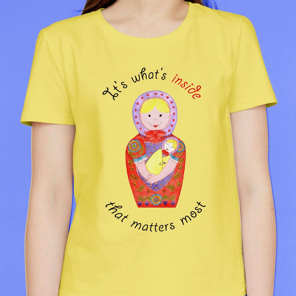 Womens Graphic Tees: Yellow T shirt “It’s what’s inside that matters most” Cotton T Shirt with Babushka Dolls