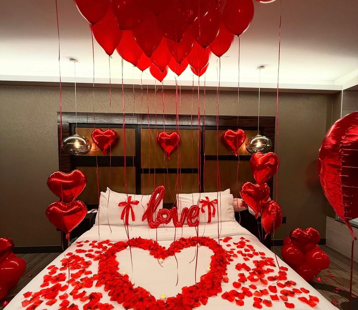 Romantic Bedroom Setup with Balloons