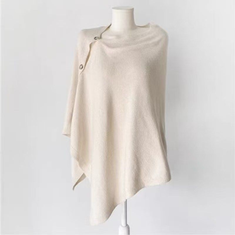Lightweight Button Detail Cape in Cream. Offering a touch of luxury and warmth wherever you go.