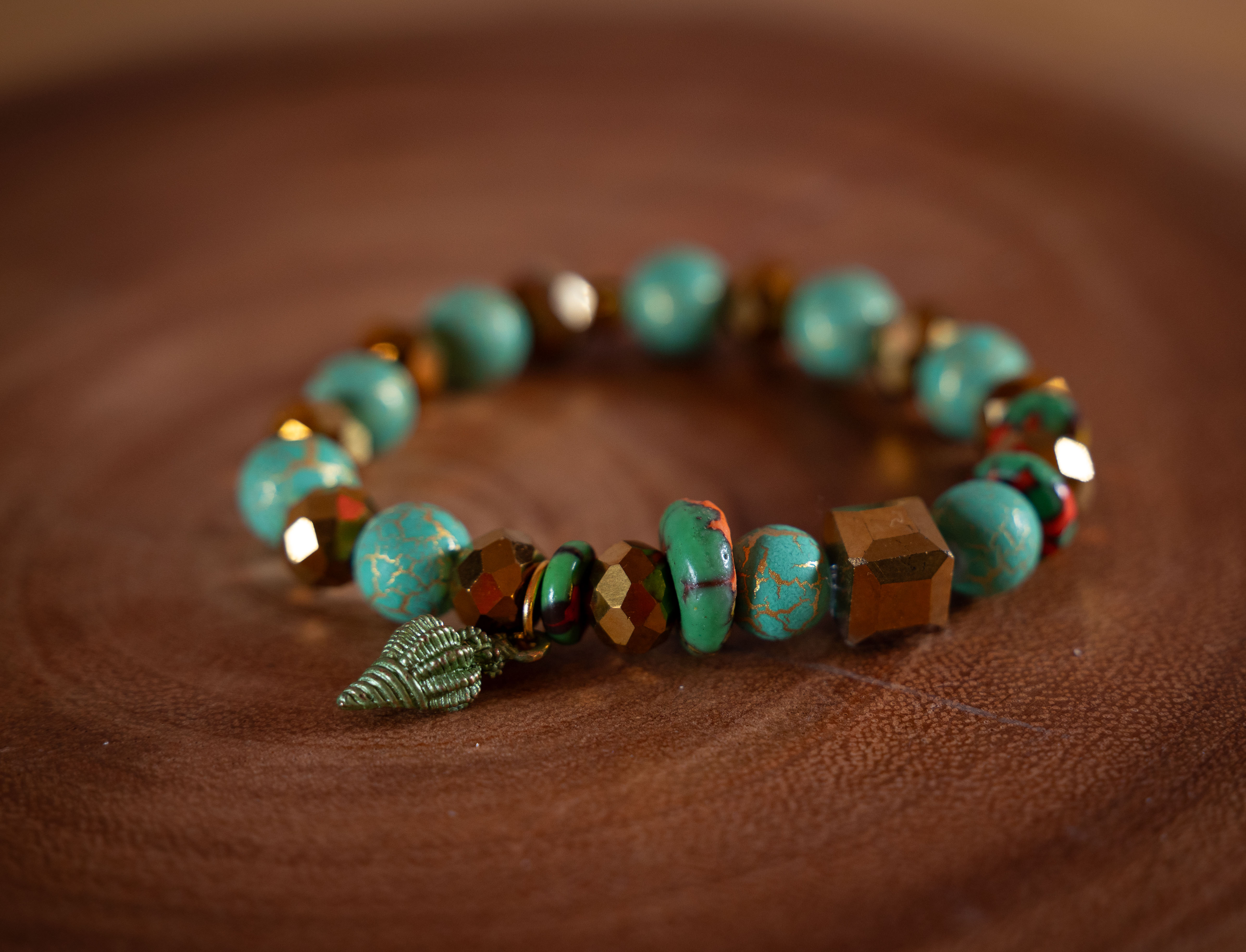 Green and Gold Beaded Bracelet with Shell Charm