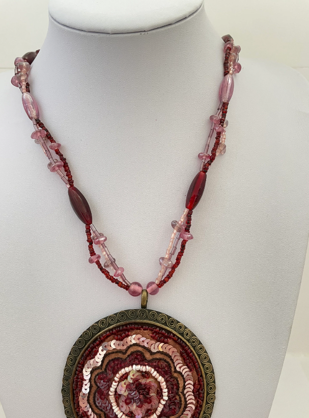 Long Beaded Multi Strand Sequin and Tassel Large Brass Pendant Pink and Red Necklace