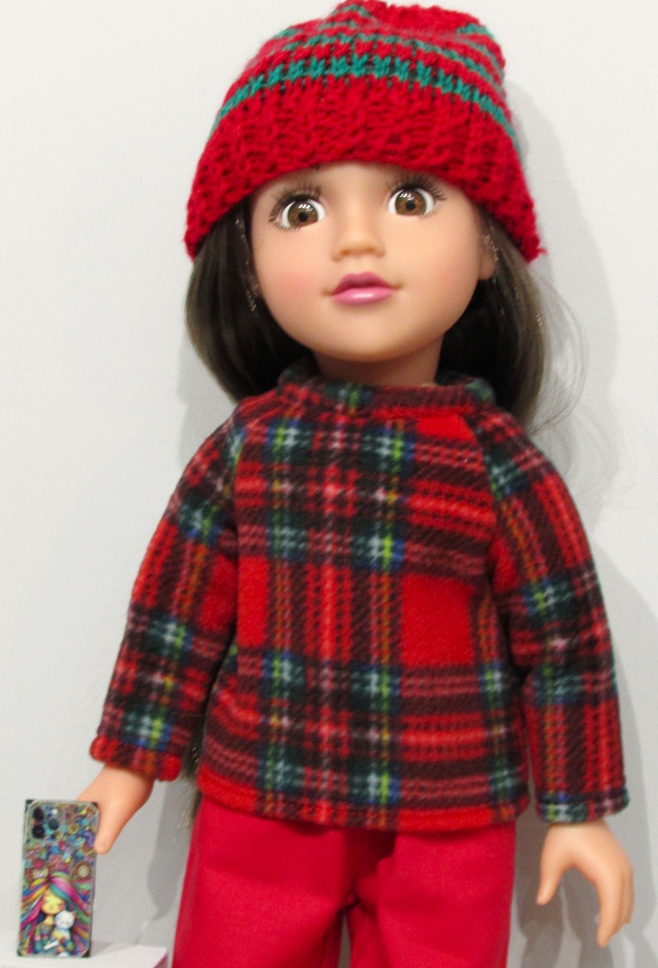 837    Tartan Fleece Top, Hat, Red Jeans, Shoes and mobile phone